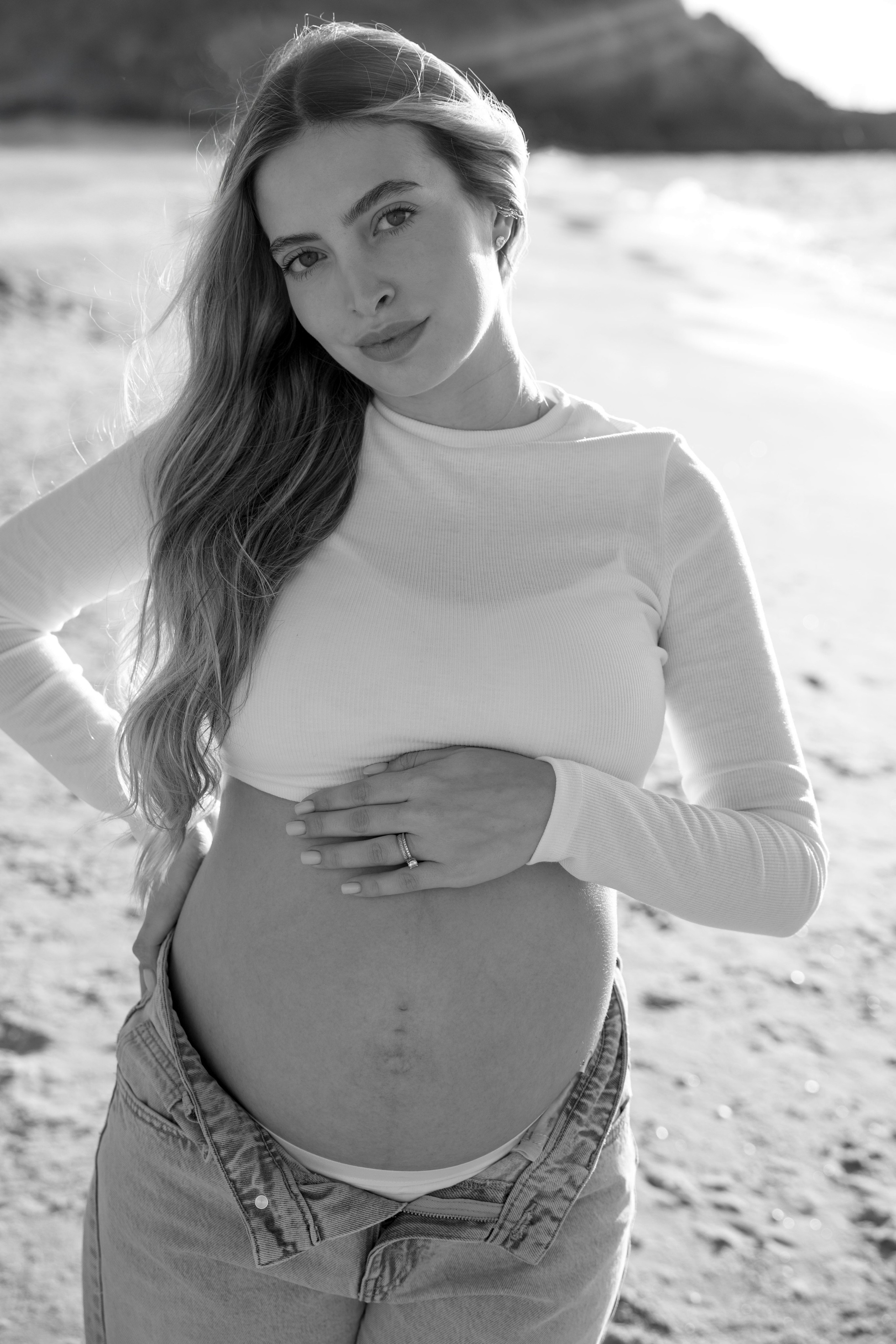 Pregnancy photoshoot near the sea. Wedding and family photographer