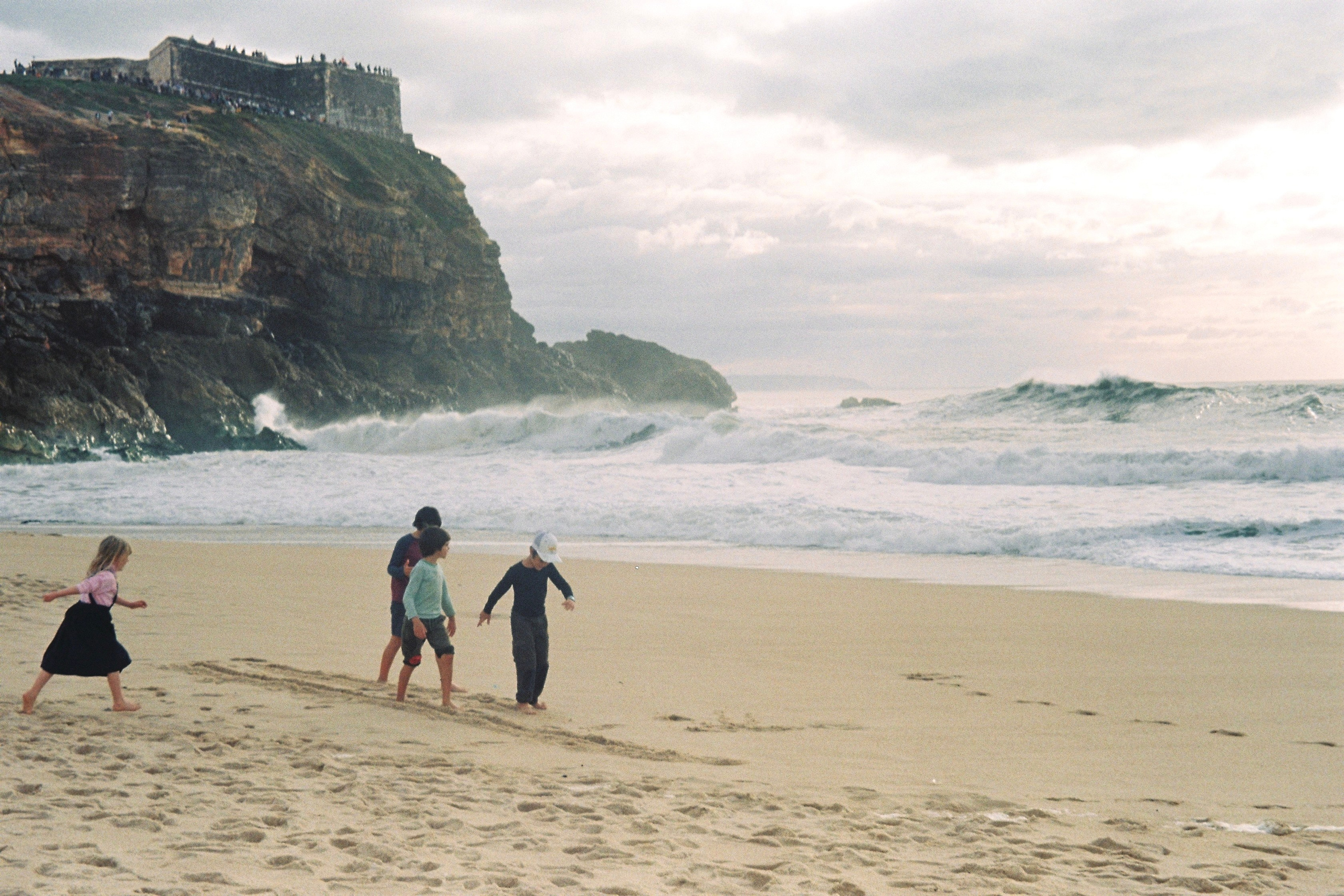 Kids playing at the beach in Portugal
