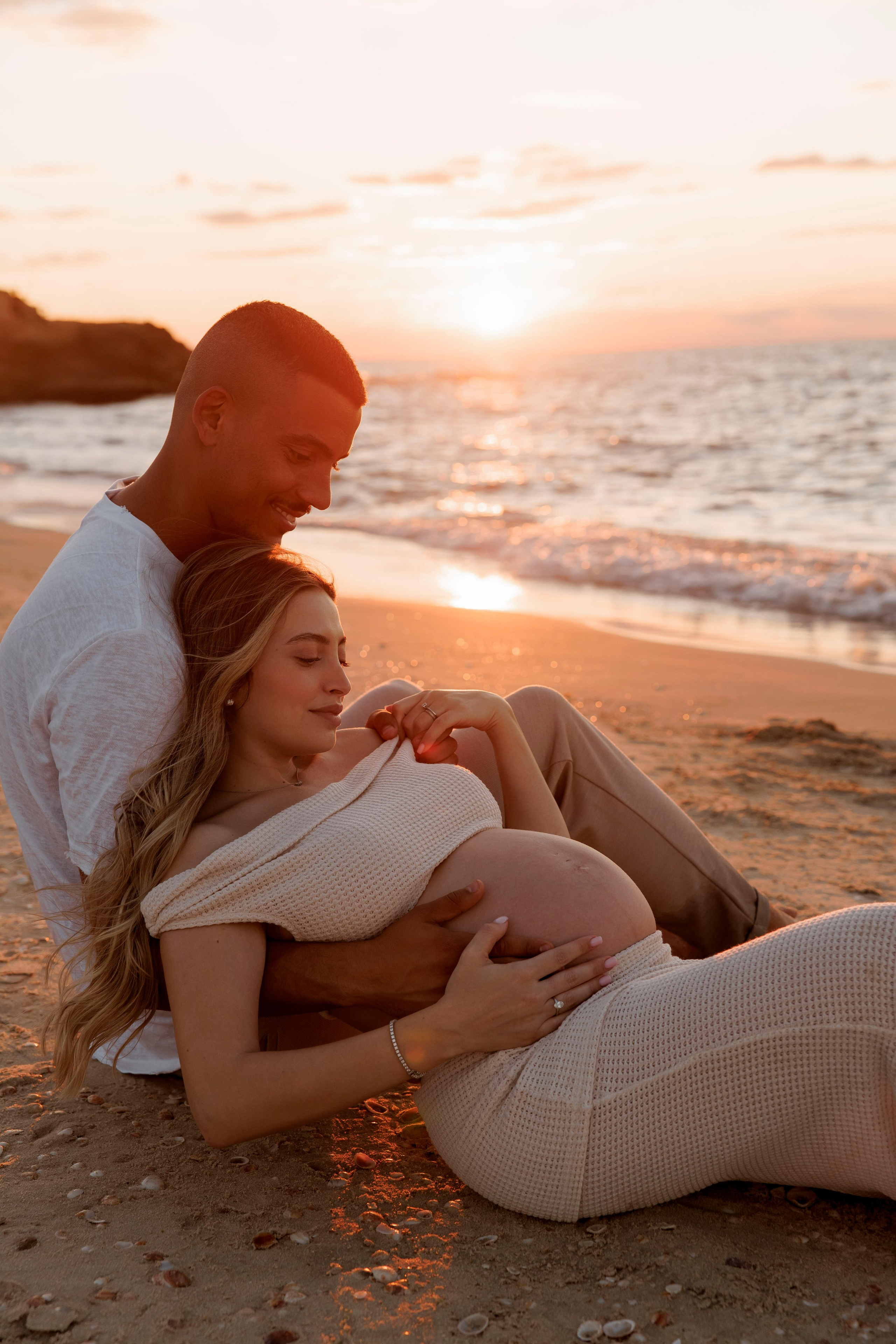 Pregnancy photoshoot near the sea. Wedding and family photographer