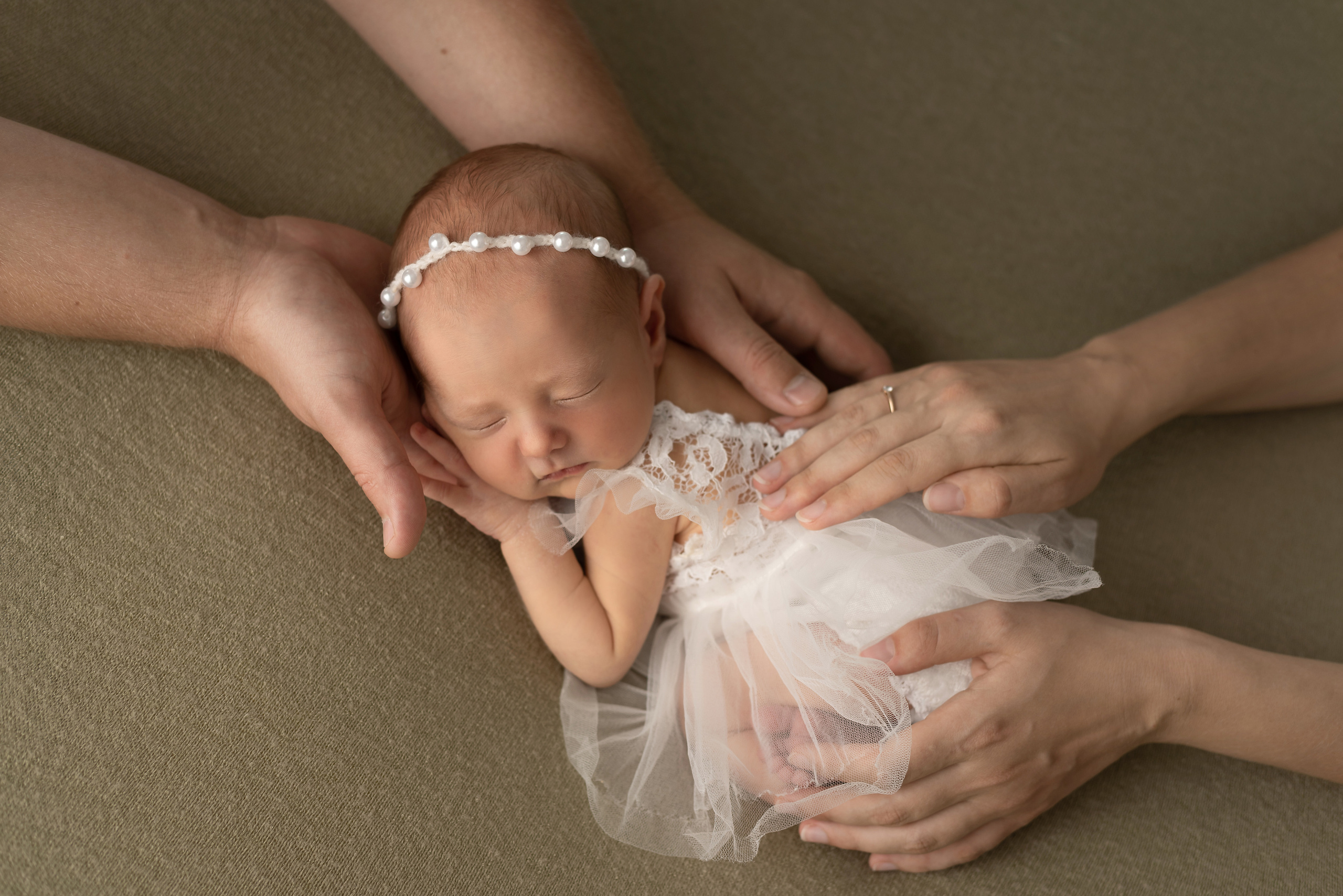Mom and dad with newborn baby girl