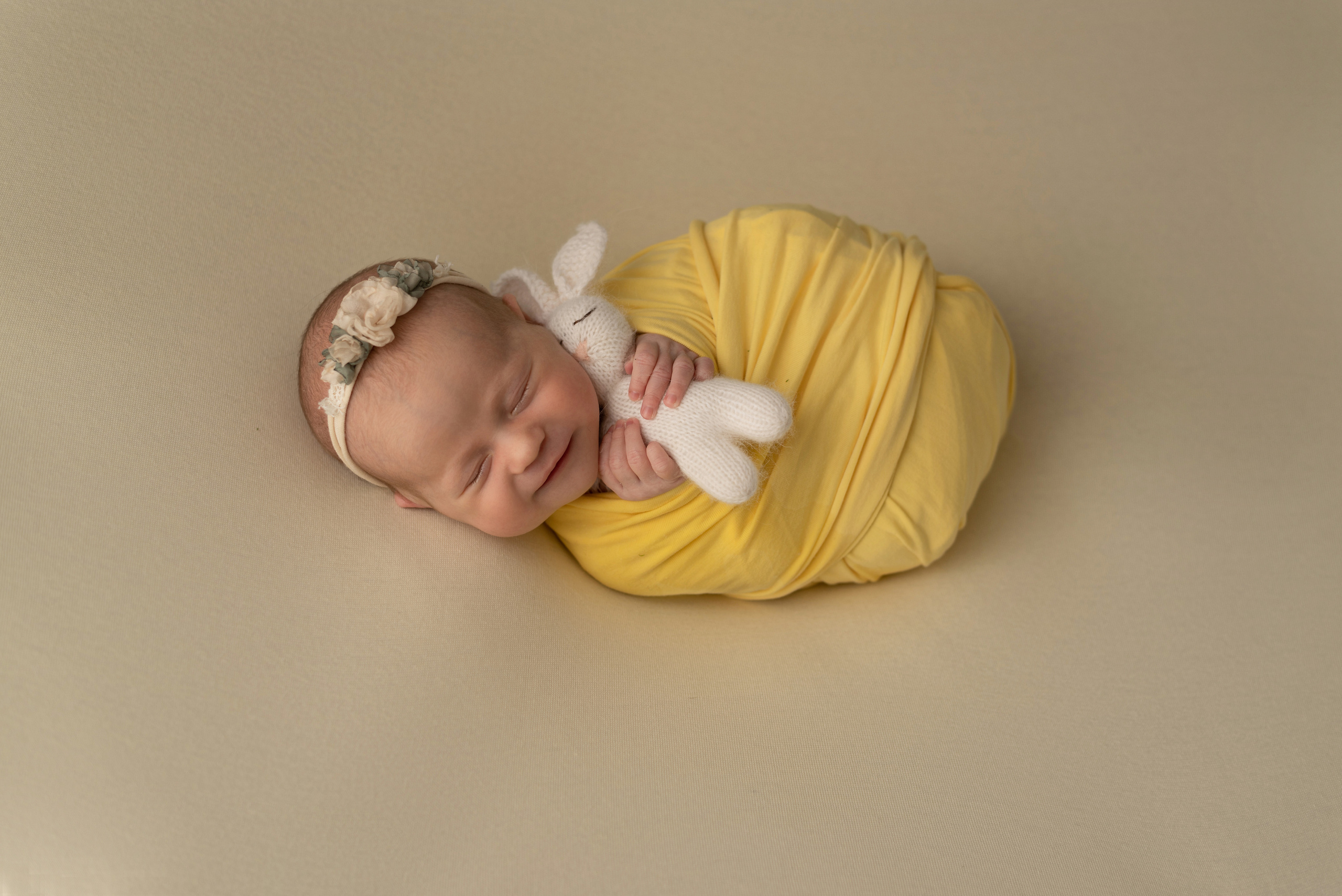 Girl holding a toy rabbit
