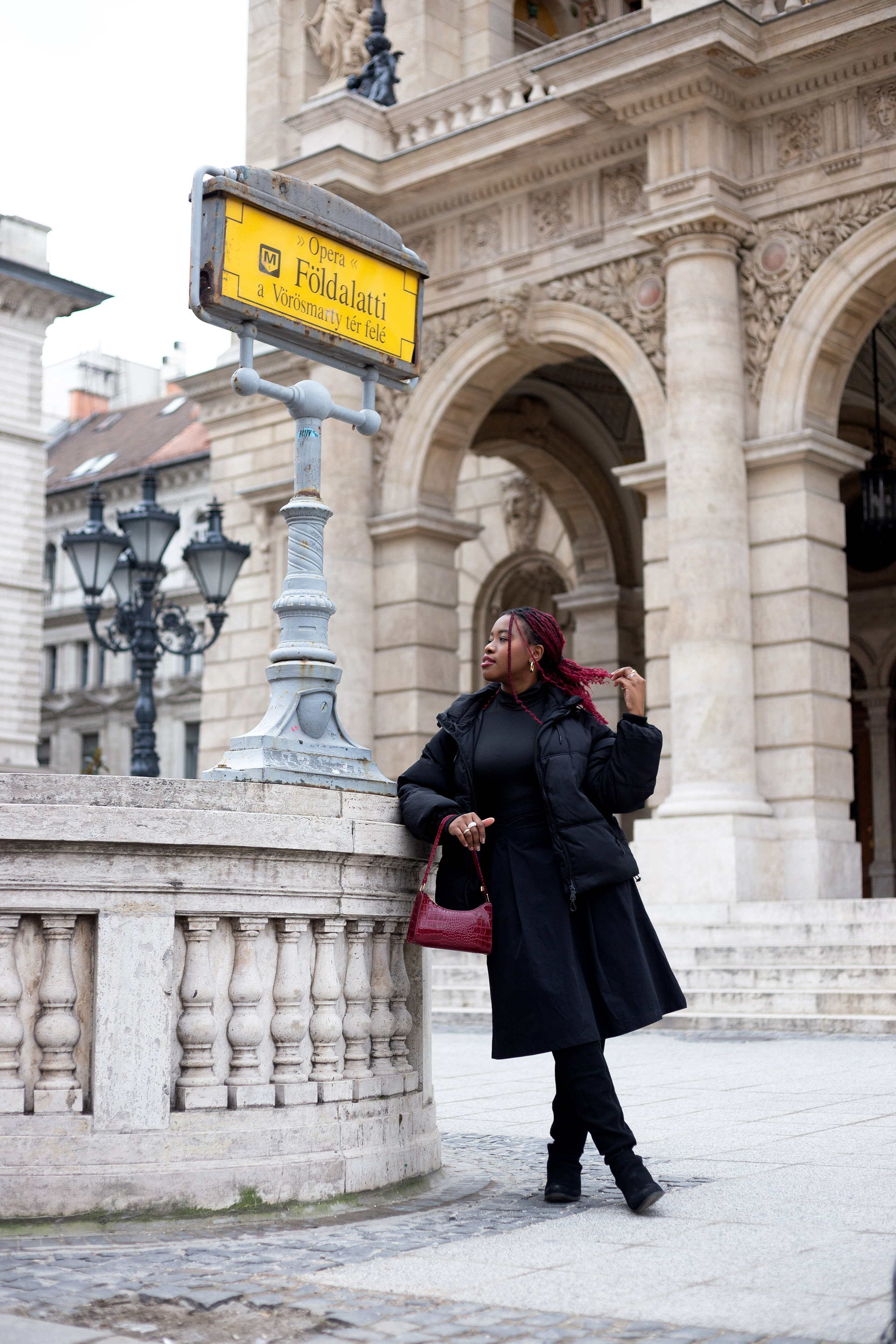 full-length portrait of a girl at the Opera metro station in Budapest