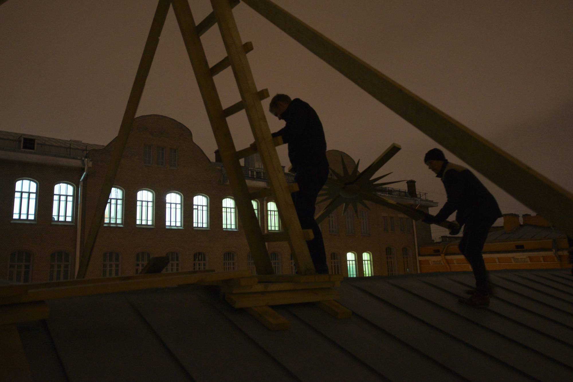 Workers on the roof of the church of St. Anne raise the cross to the dome. On October 27, 2018, Annenkirche turned 239 years old. On this day, a cross was erected on the dome of the church, which had been missing for 80 years. Money for the cross was collected in a month using the crowdfunding program.