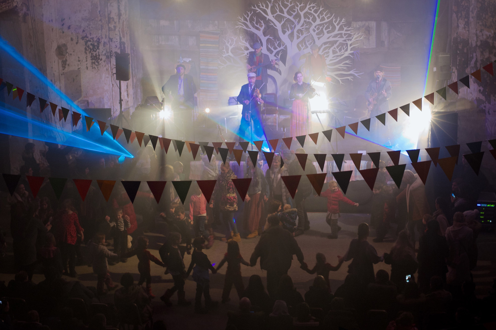 Spectators perform a round dance during a concert by Otawa Yo.