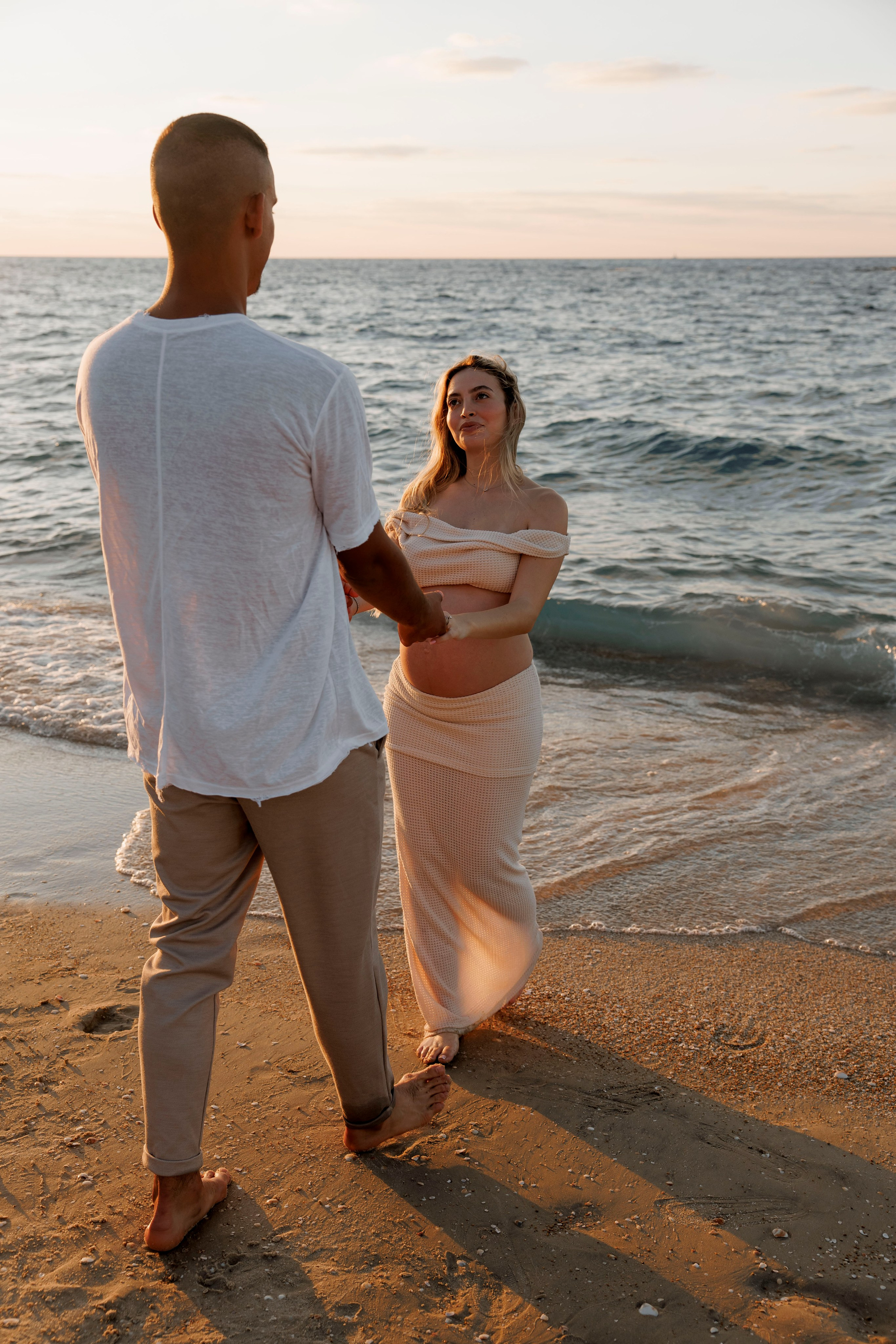 Pregnancy photoshoot near the sea. Wedding and family photographer