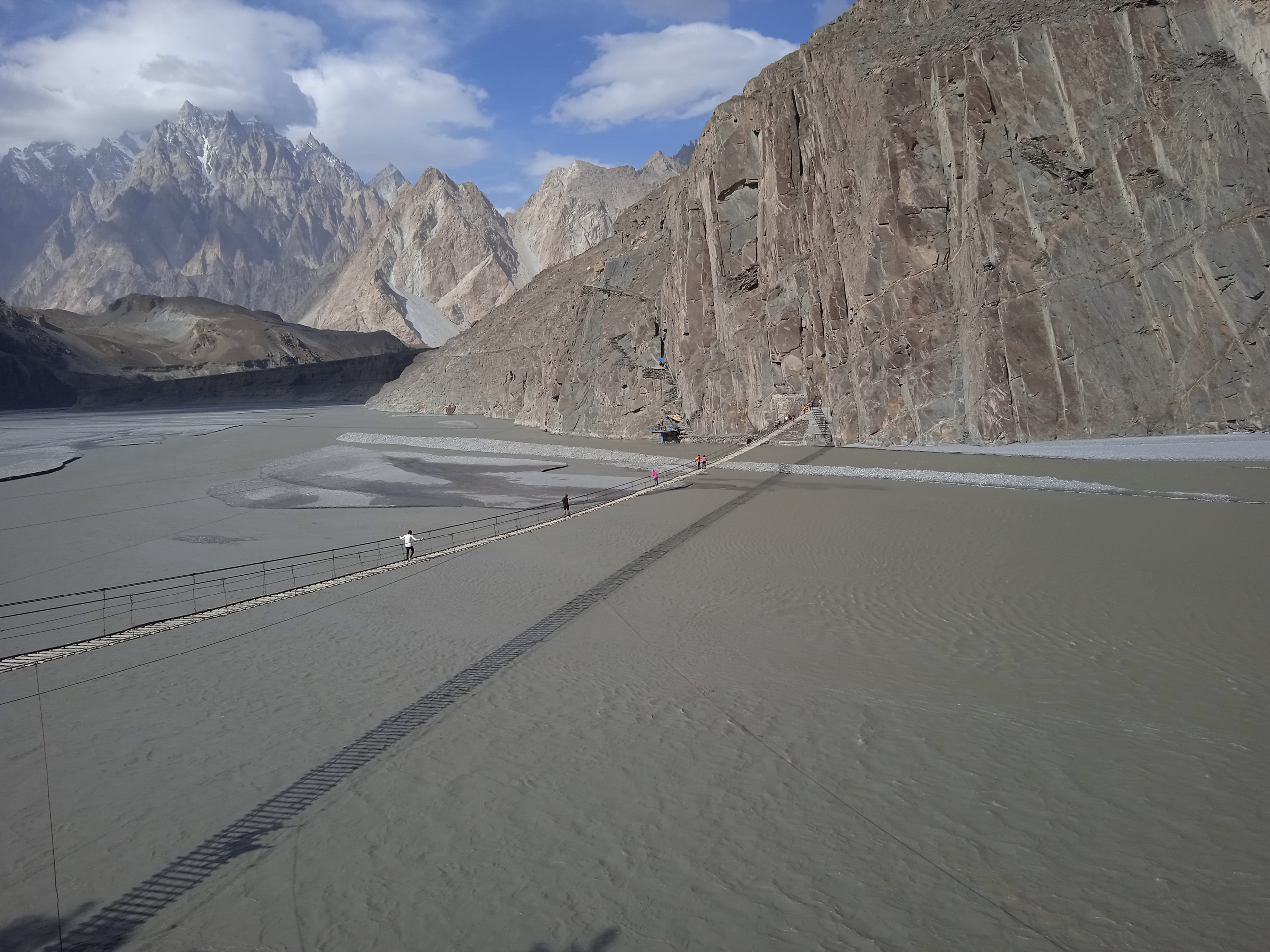 Suspension bridge over a mountain river