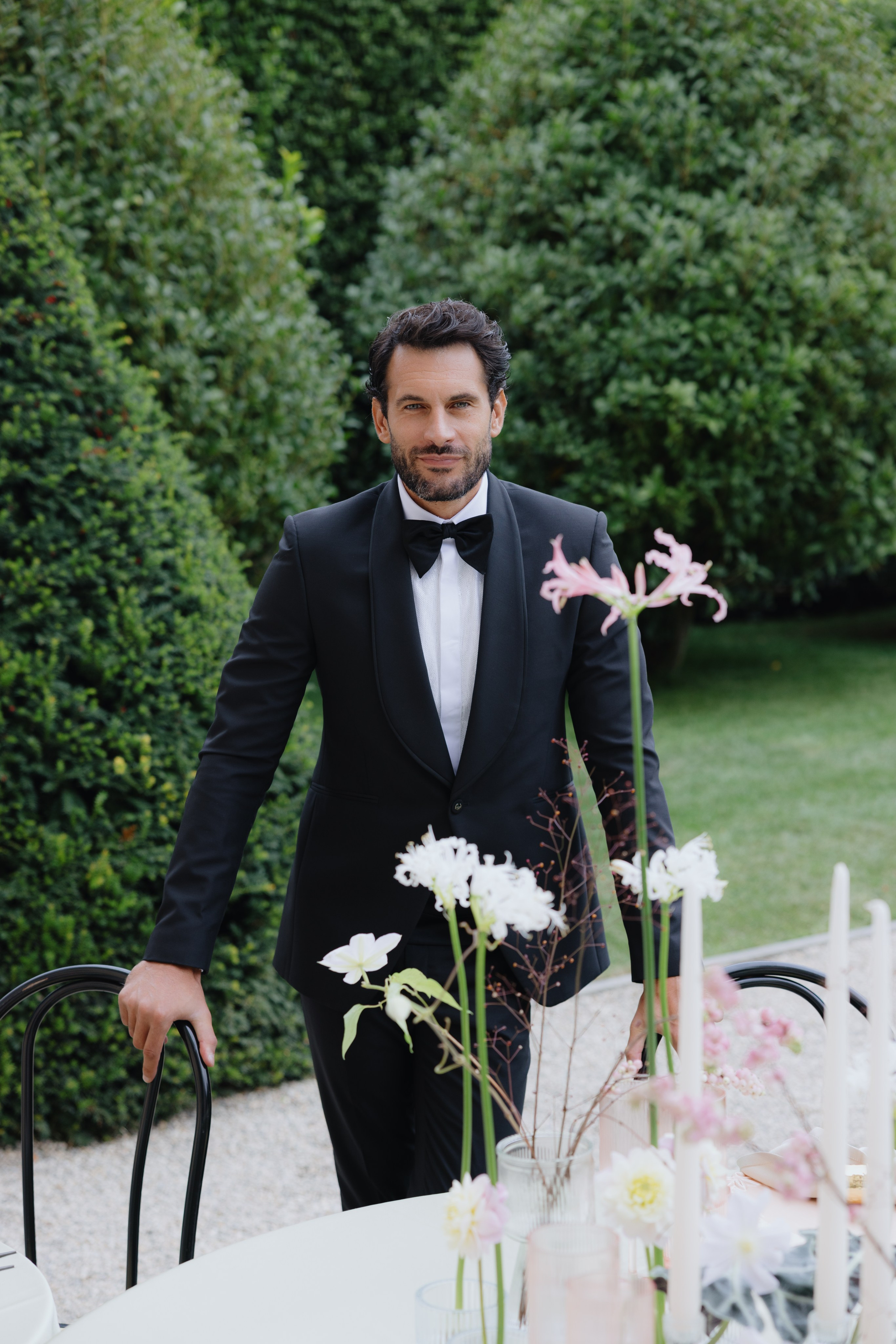 Groom portrait in a tailored tuxedo before the ceremony
