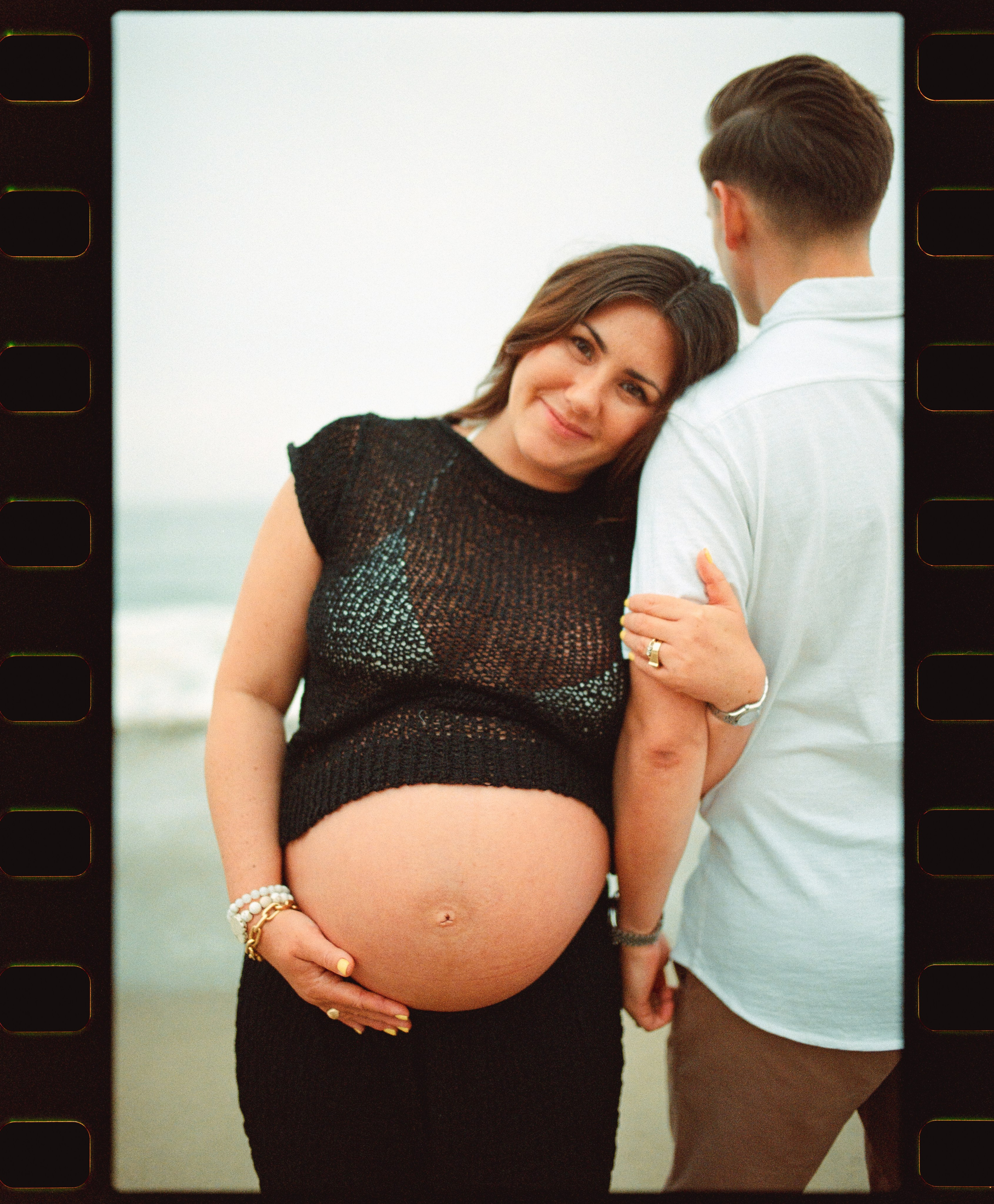film photo of a pregnant couple in Malibu, California