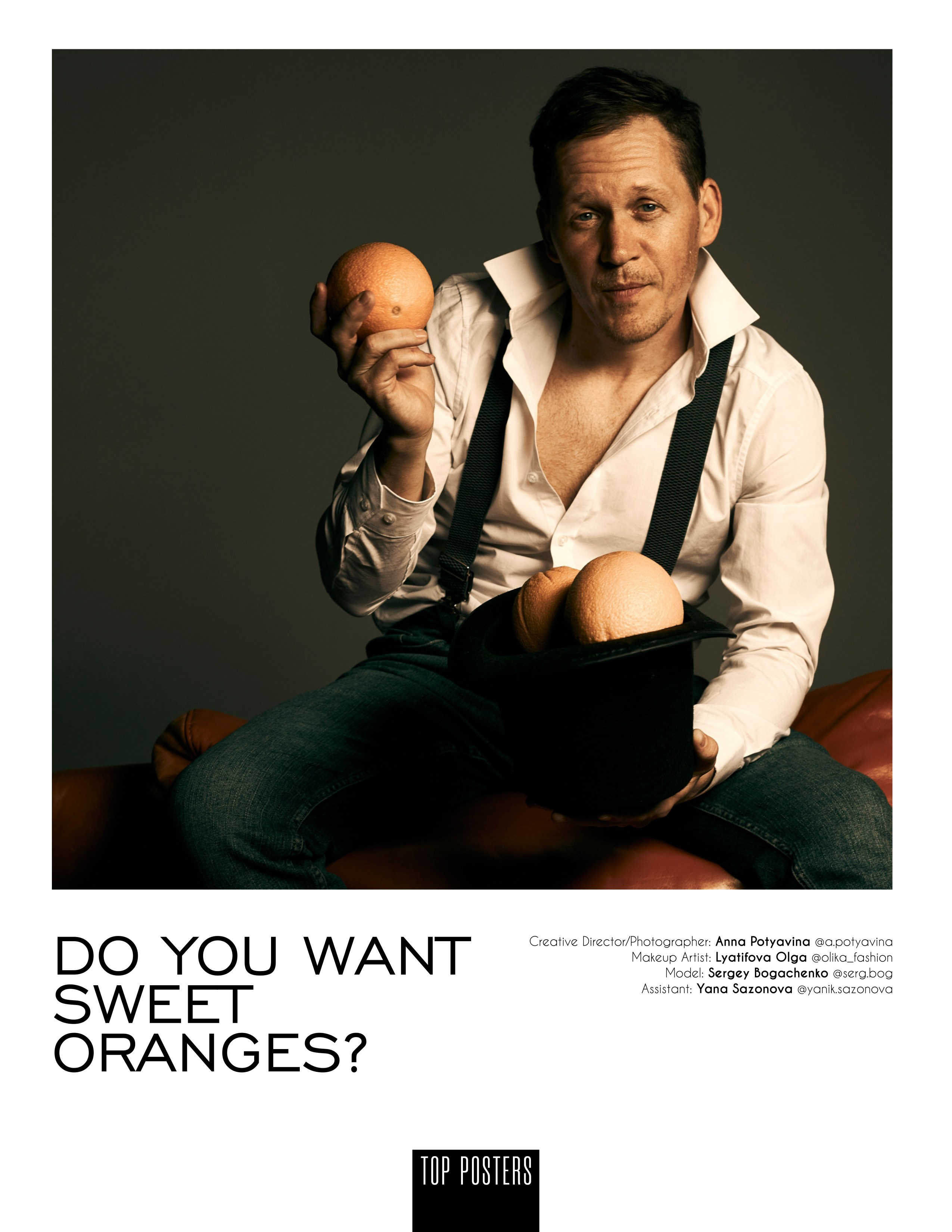 Портрет мужчины в белой рубашке, джинсах с подтяжками, мужчина держит в руках апельсины 