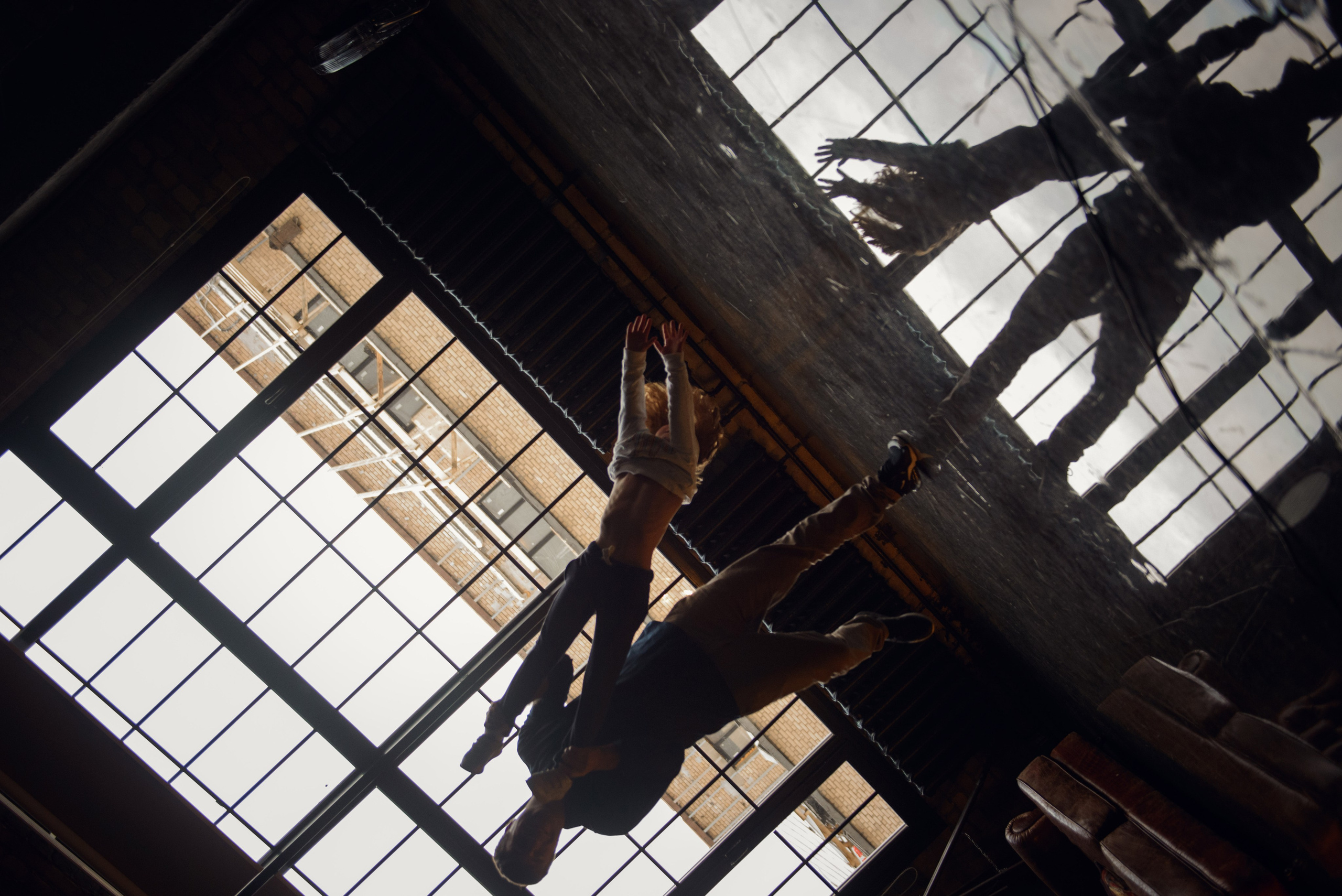 dad and daughter in a dark photo studio
