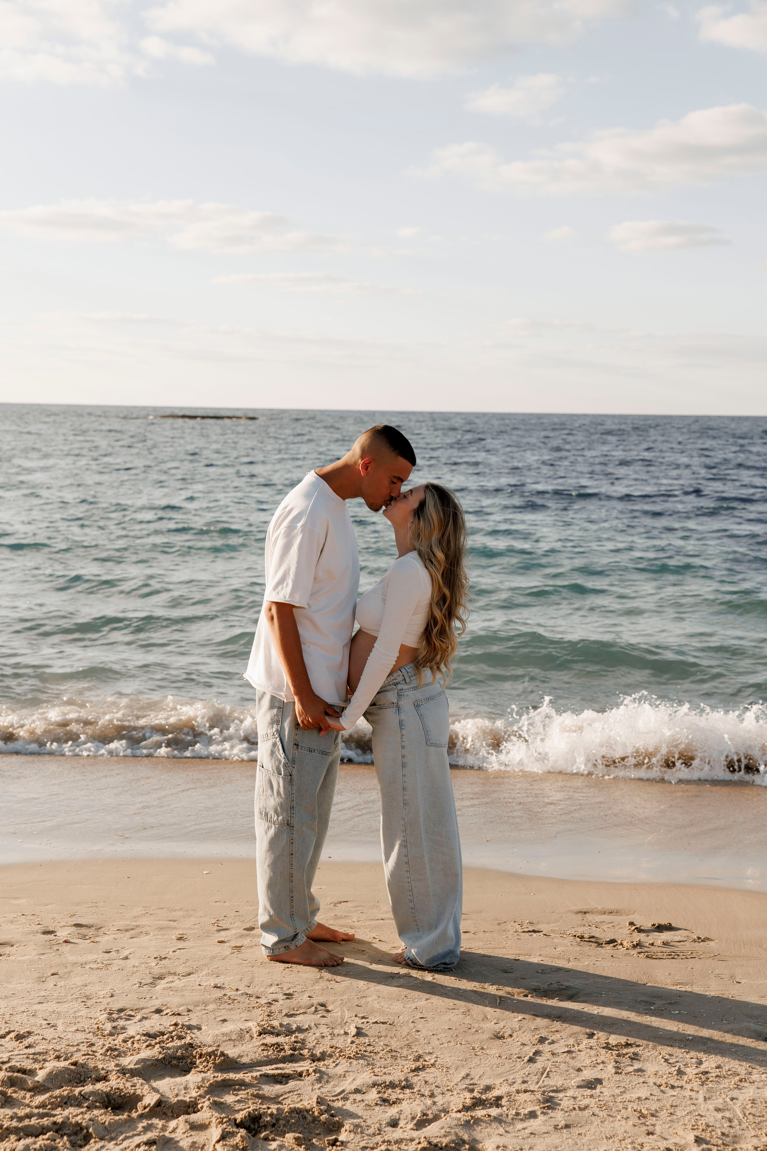 Pregnancy photoshoot near the sea. Wedding and family photographer