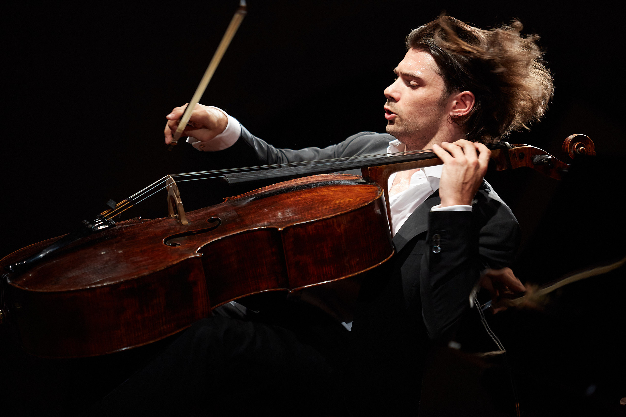 Emotional photo of Gautier Capuçon French cello player on the stage.