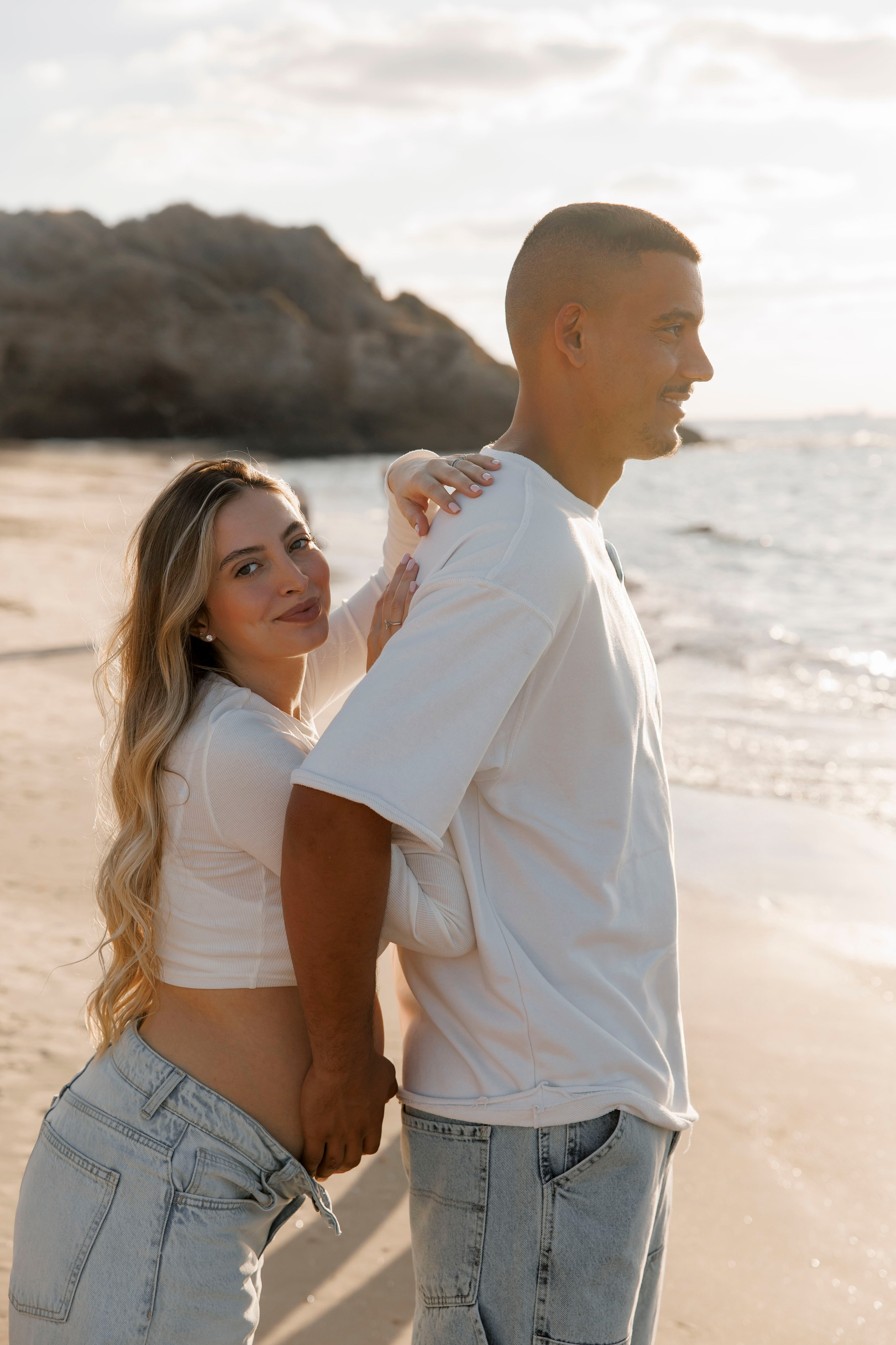 Pregnancy photoshoot near the sea. Wedding and family photographer