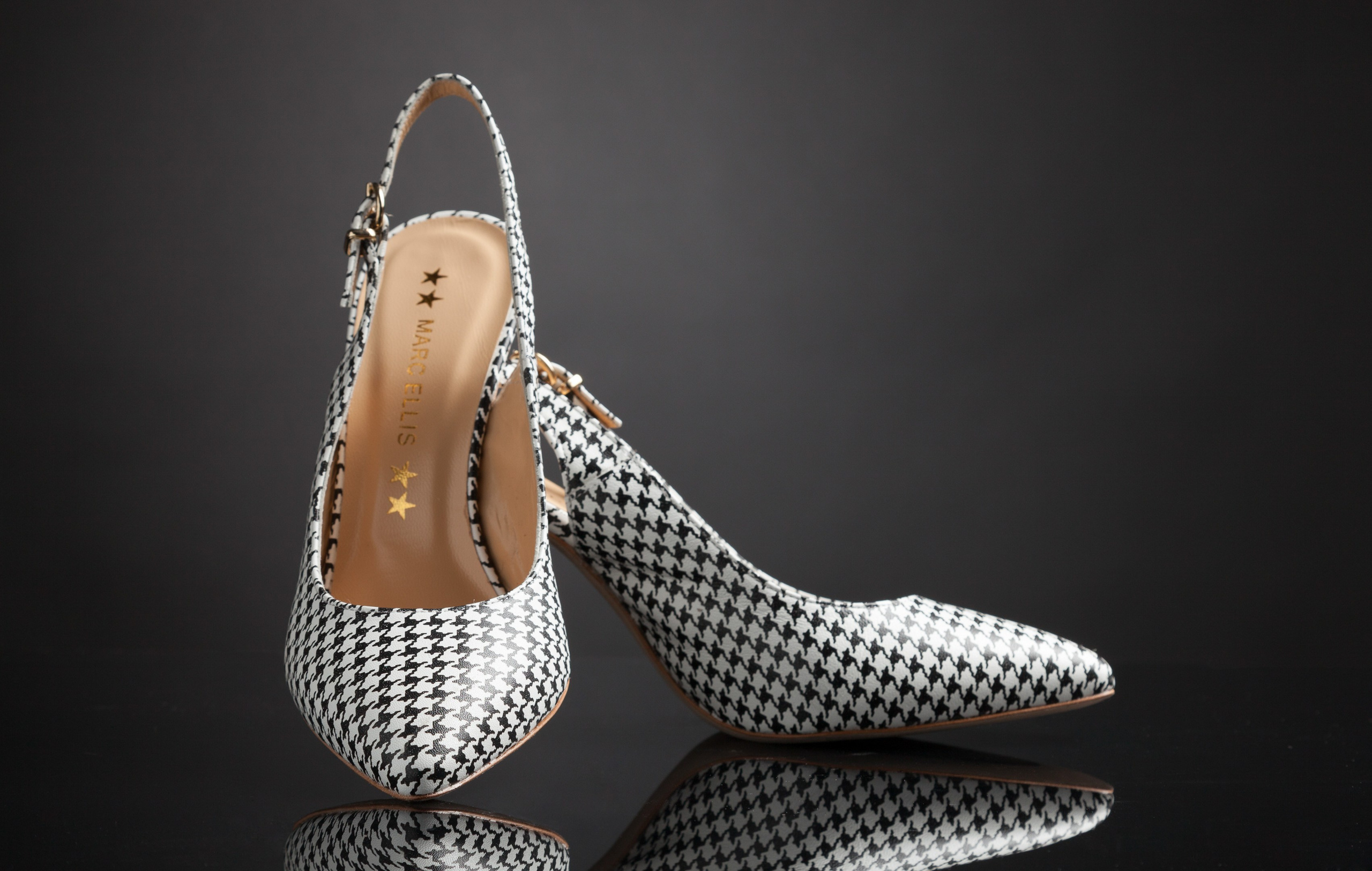 High heel shoes on dark grey mirror background - photographer Andrey Dunin