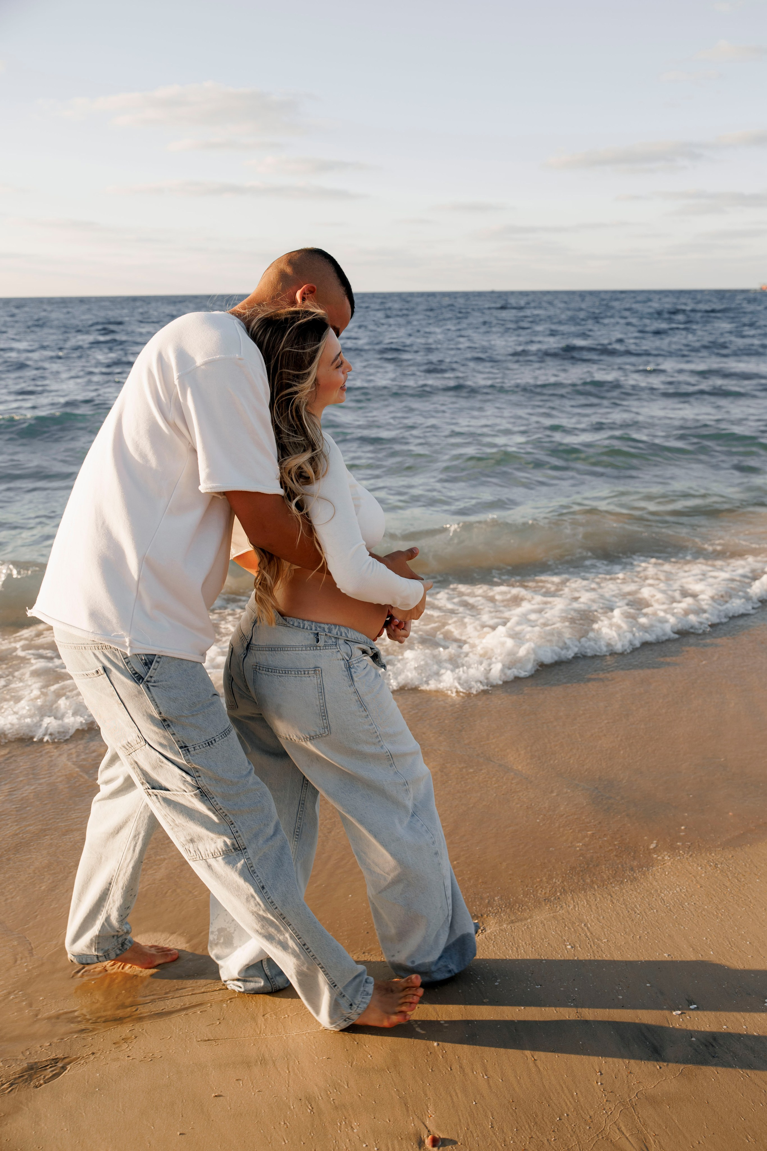 Pregnancy photoshoot near the sea. Wedding and family photographer