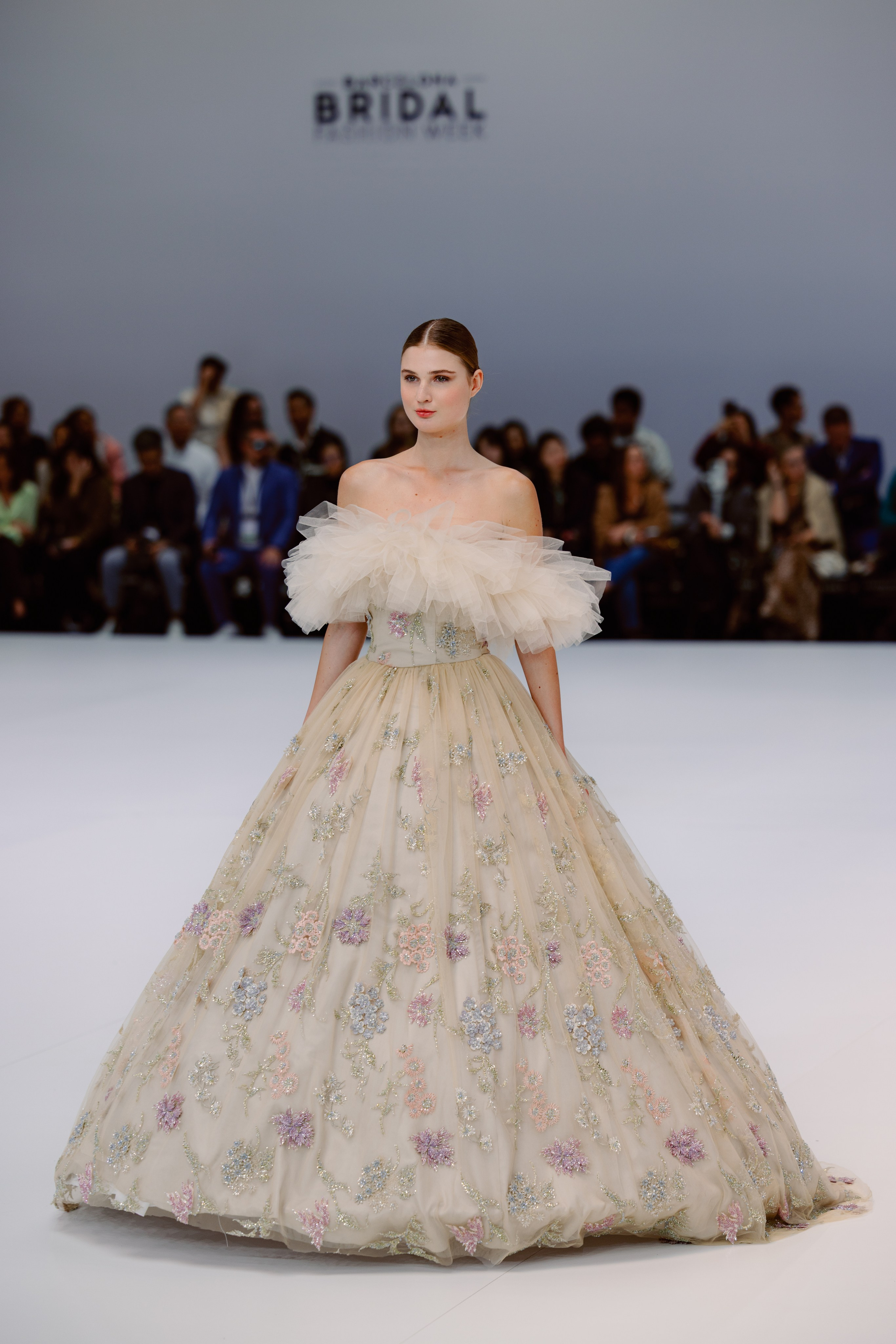 Modern wedding dress with cape by Julia Kontogruni at Barcelona Bridal Fashion Week