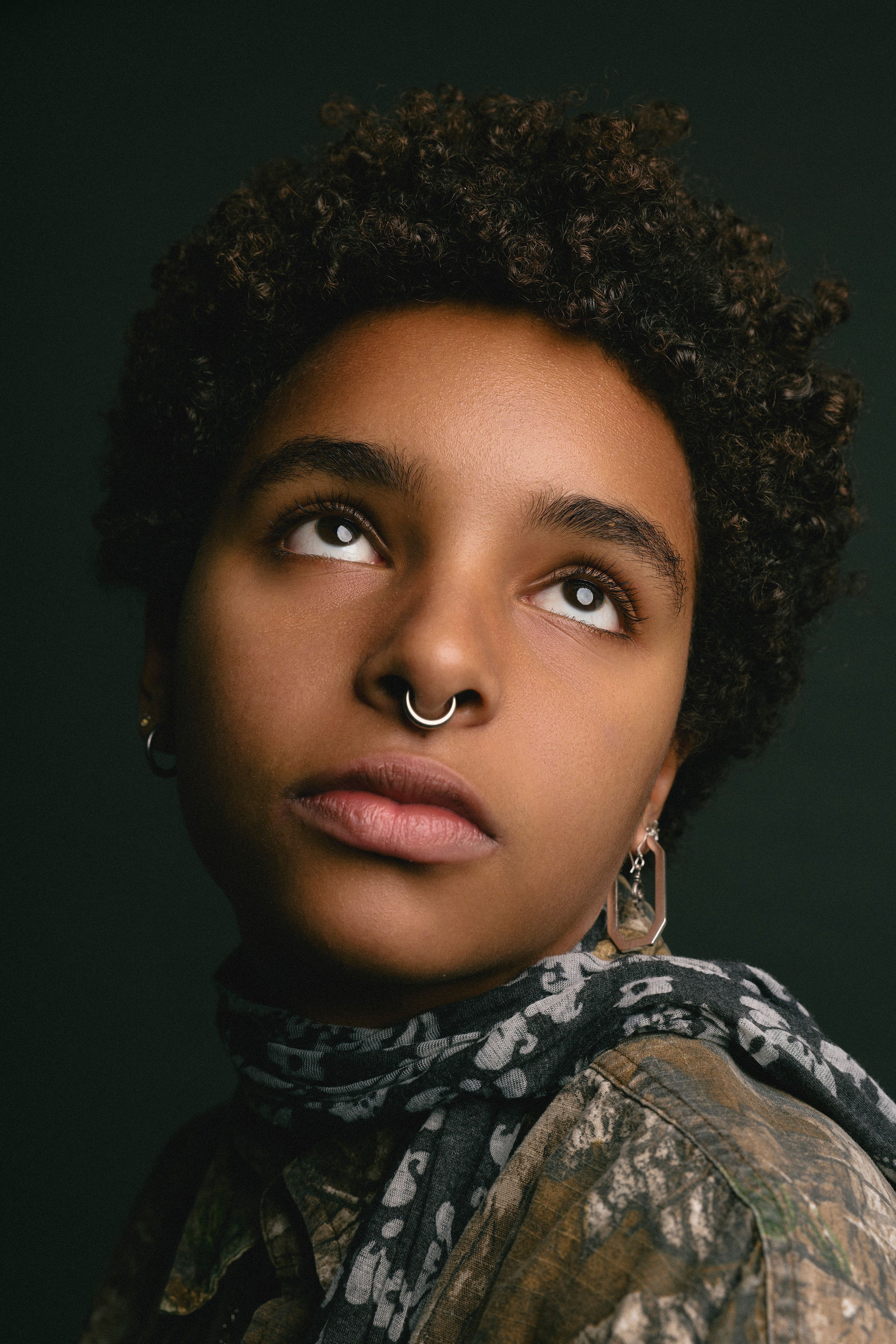 Studio portrait of a mixed-race woman with soft professional lighting