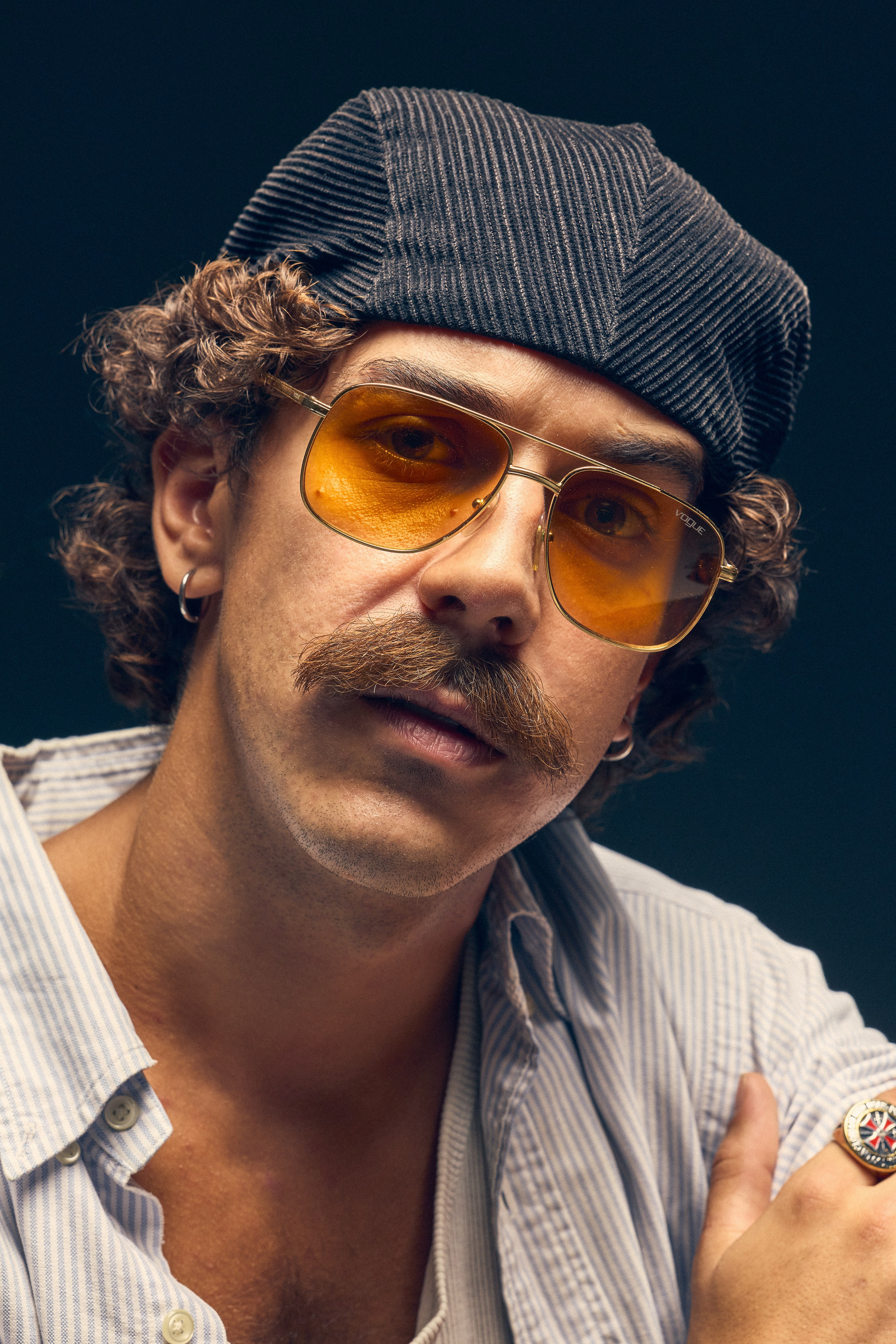 Editorial retro photo with male model in dramatic light