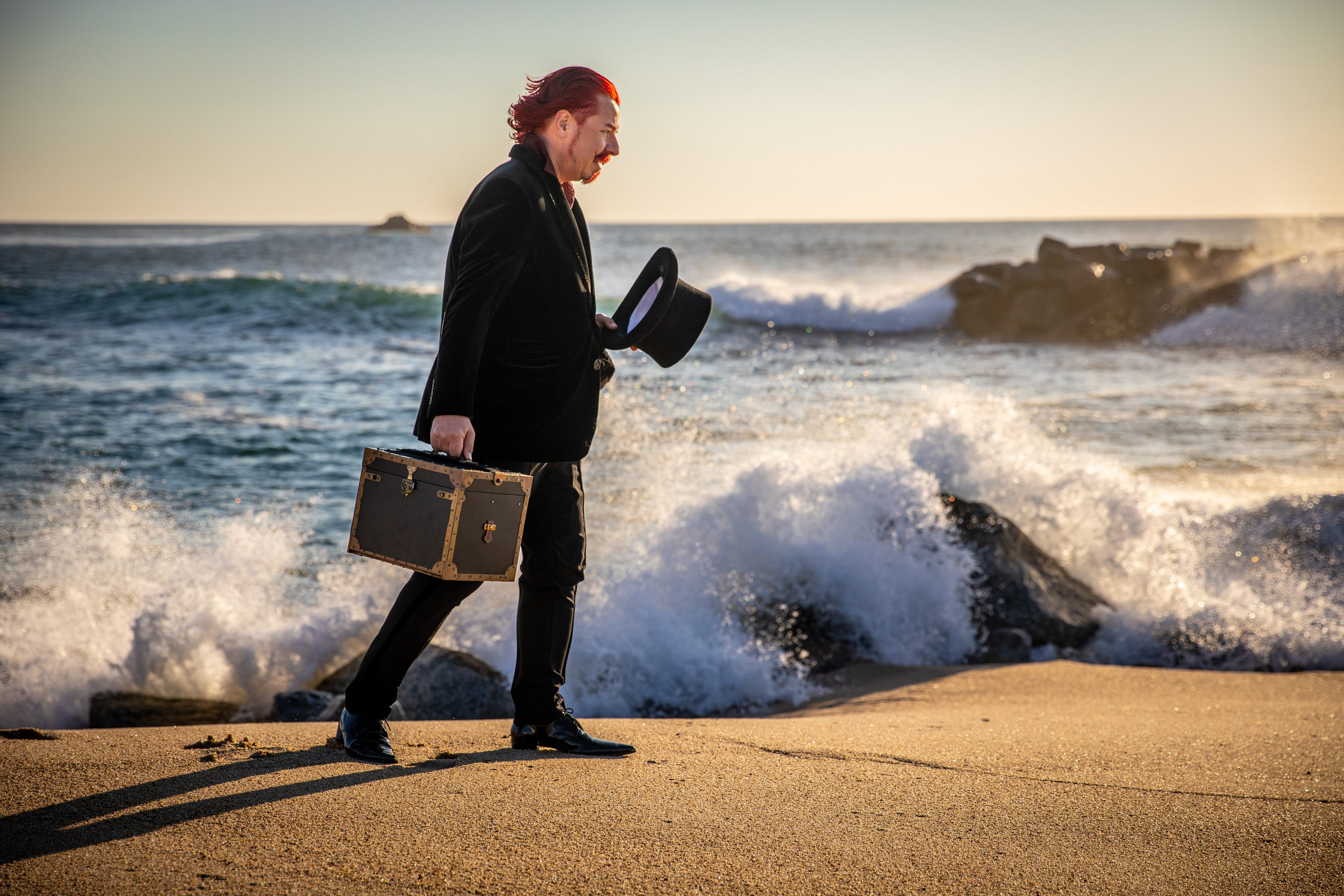 Magician and illusionist. Photo walk on the beach
