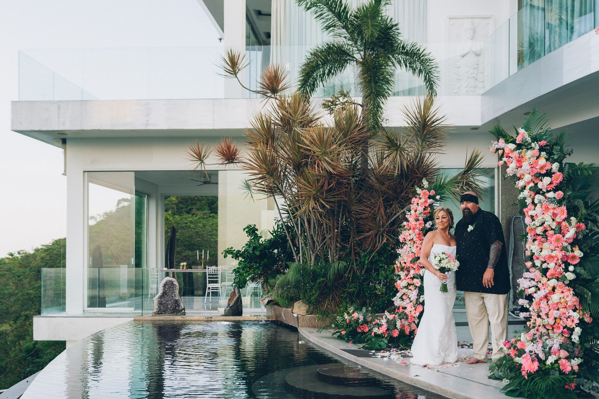 Bride and groom celebrating a sunset wedding at a villa in Koh Samui