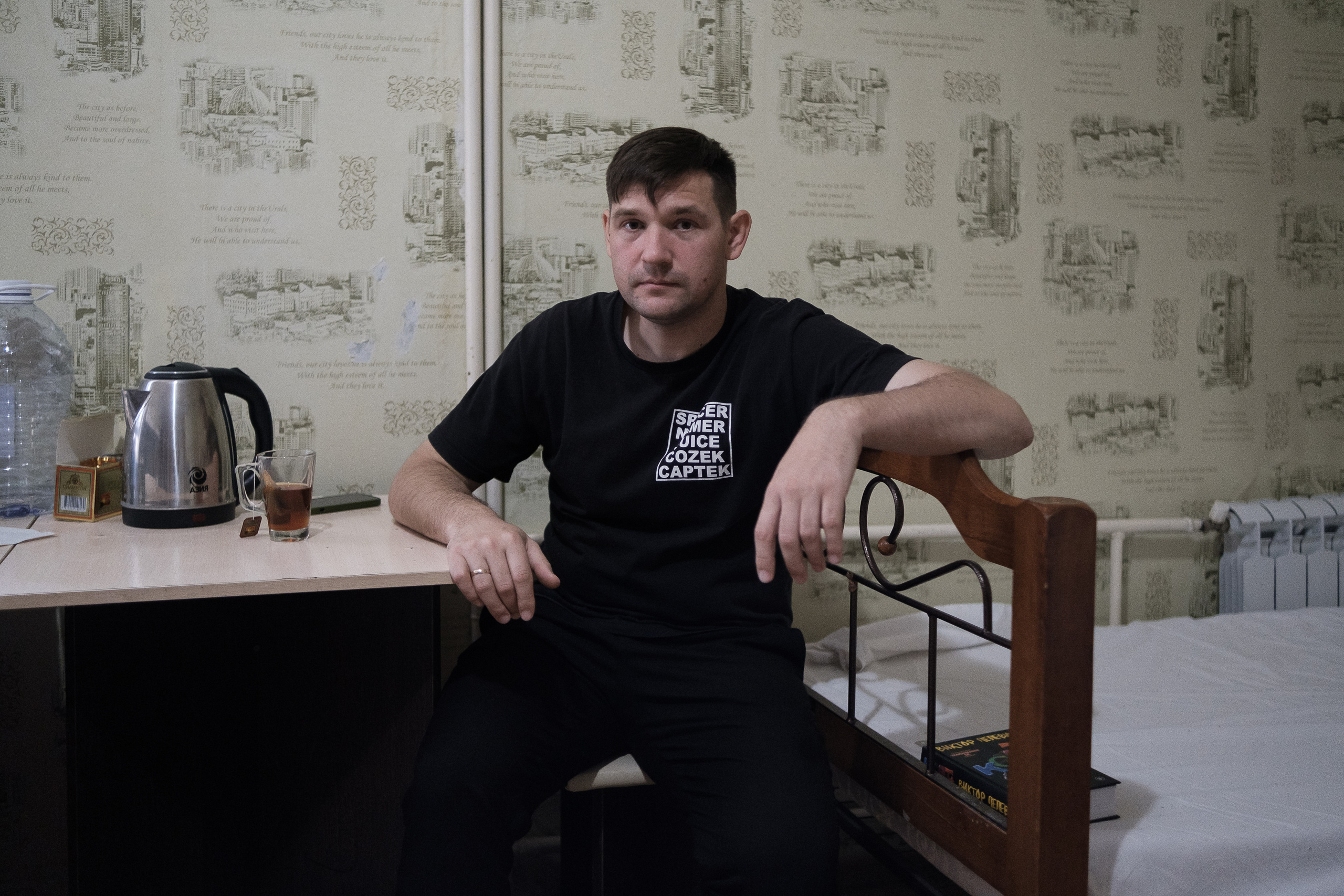 Yuri from Moscow at the hostel in Astana. Prior to the start of the partial mobilization, Yuri lived in Moscow with his wife. He had his own business, a good income and a well-established life. Since the beginning of the war, the family began to think about moving from Russia, but no one expected that they would have to emigrate quickly. Yuri took tickets from Moscow to Saratov and crossed the border with Kazakhstan through the city of Uralsk. Already in Uralsk, Yuri met with his friend, with whom they got to Astana together and settled in a hostel. Yuri's wife remains in Russia for the time being. There she handles the paperwork and sells all the property before moving in with her husband. The minimum condition for returning to Russia for Yuri is the end of the war.