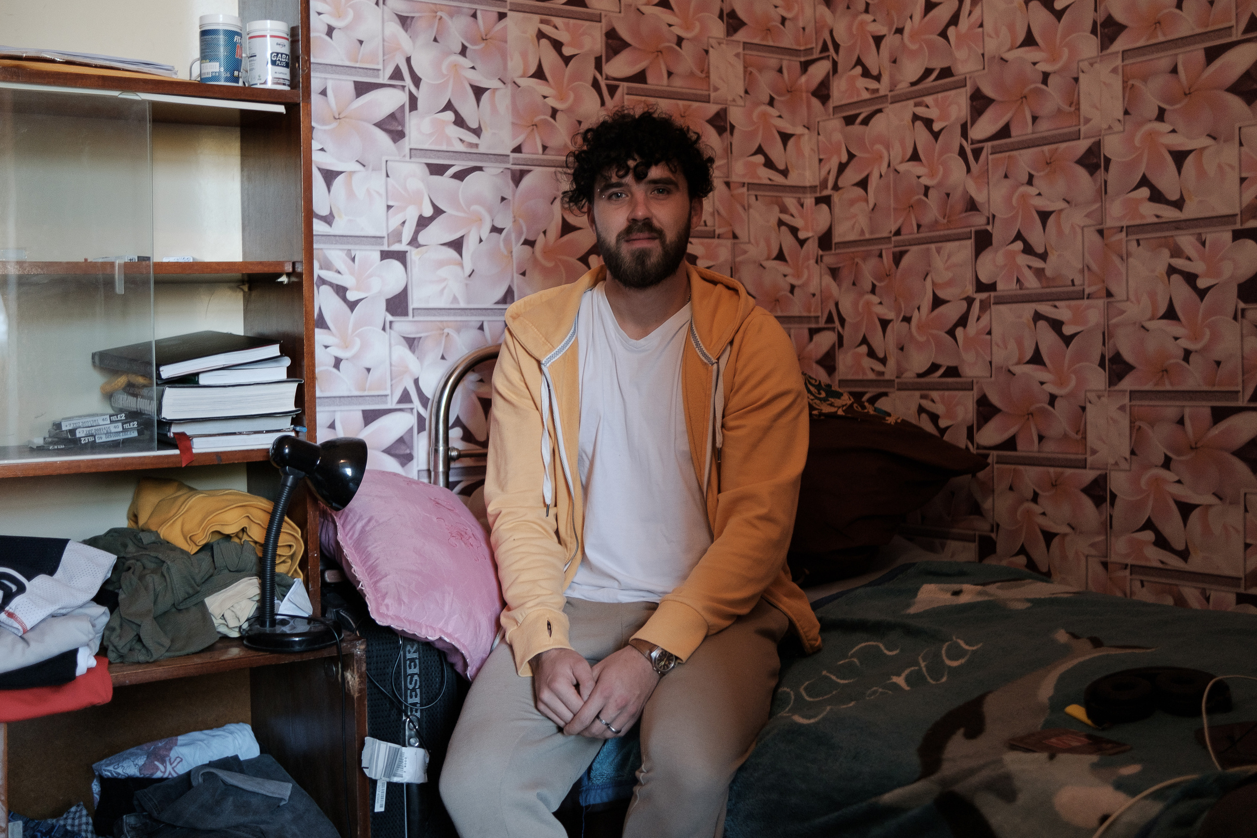 Ivan from Saratov in his room in a rented apartment in Uralsk. Ivan left Russia two days after the start of the partial mobilization. At first, Ivan and his friends slept in the car and took a shower at a local coffee shop, where one of the volunteers who helped the Russians arrived worked. Later, Ivan and his friends managed to rent a small apartment. Now Ivan is settling in a new place and looking for a job in Uralsk.