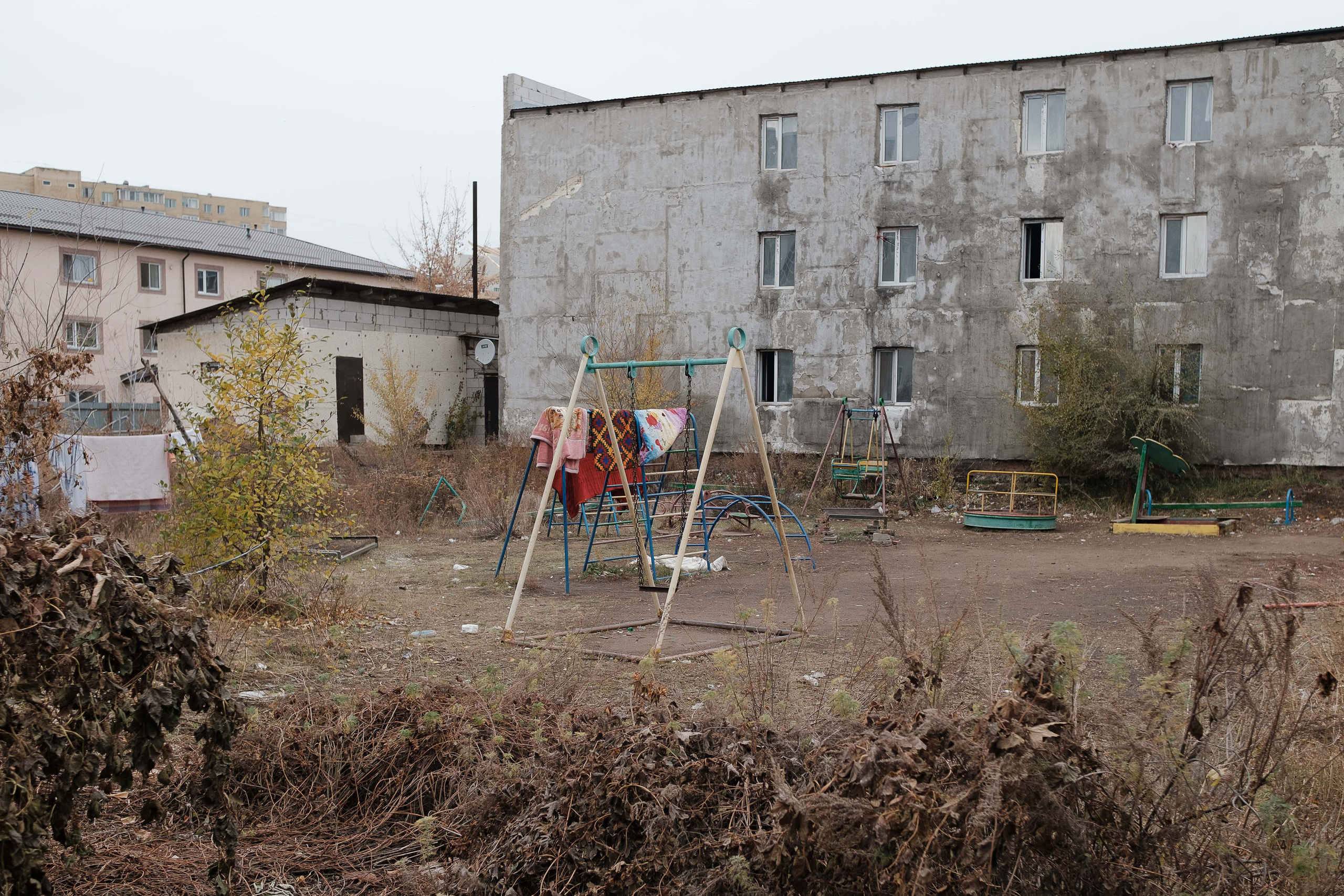Children's playground in Astana near the territory of the hostel, where do the relocants from  Russia live.