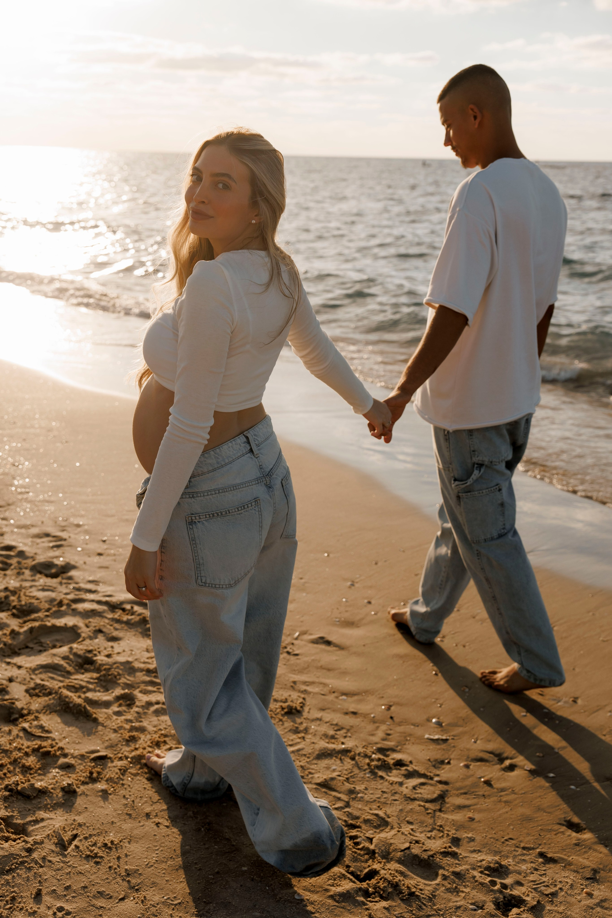 Pregnancy photoshoot near the sea. Wedding and family photographer