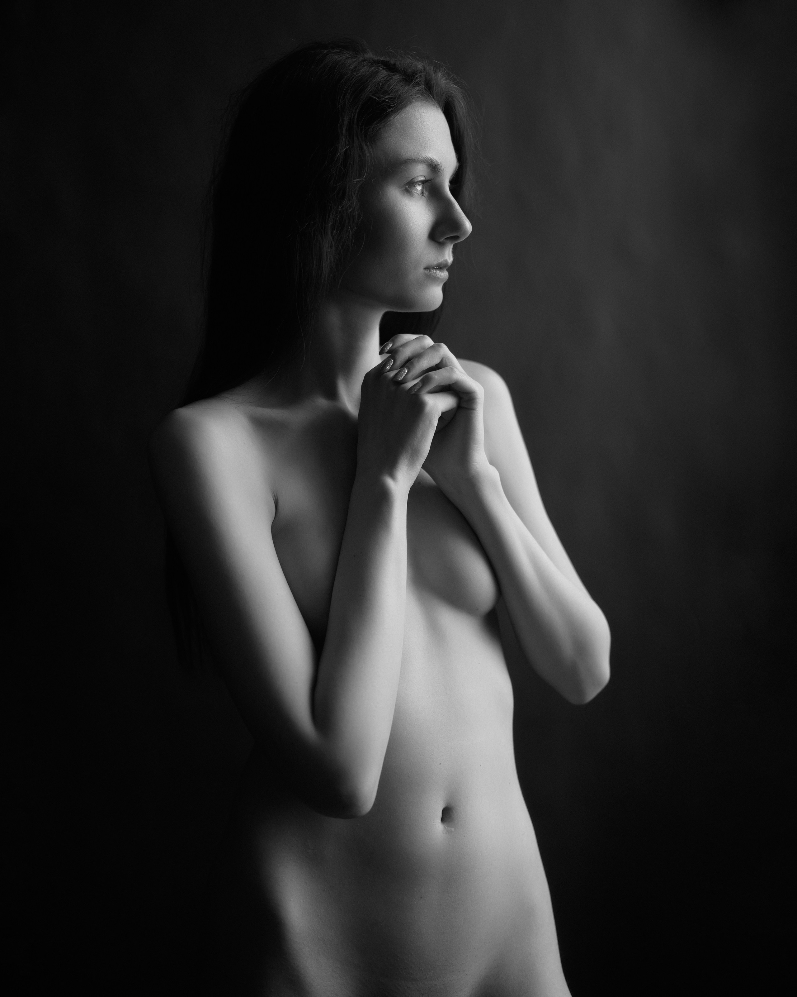 A series of creative photos taken in the studio. The photos are made in the nude genre. Black and white photo