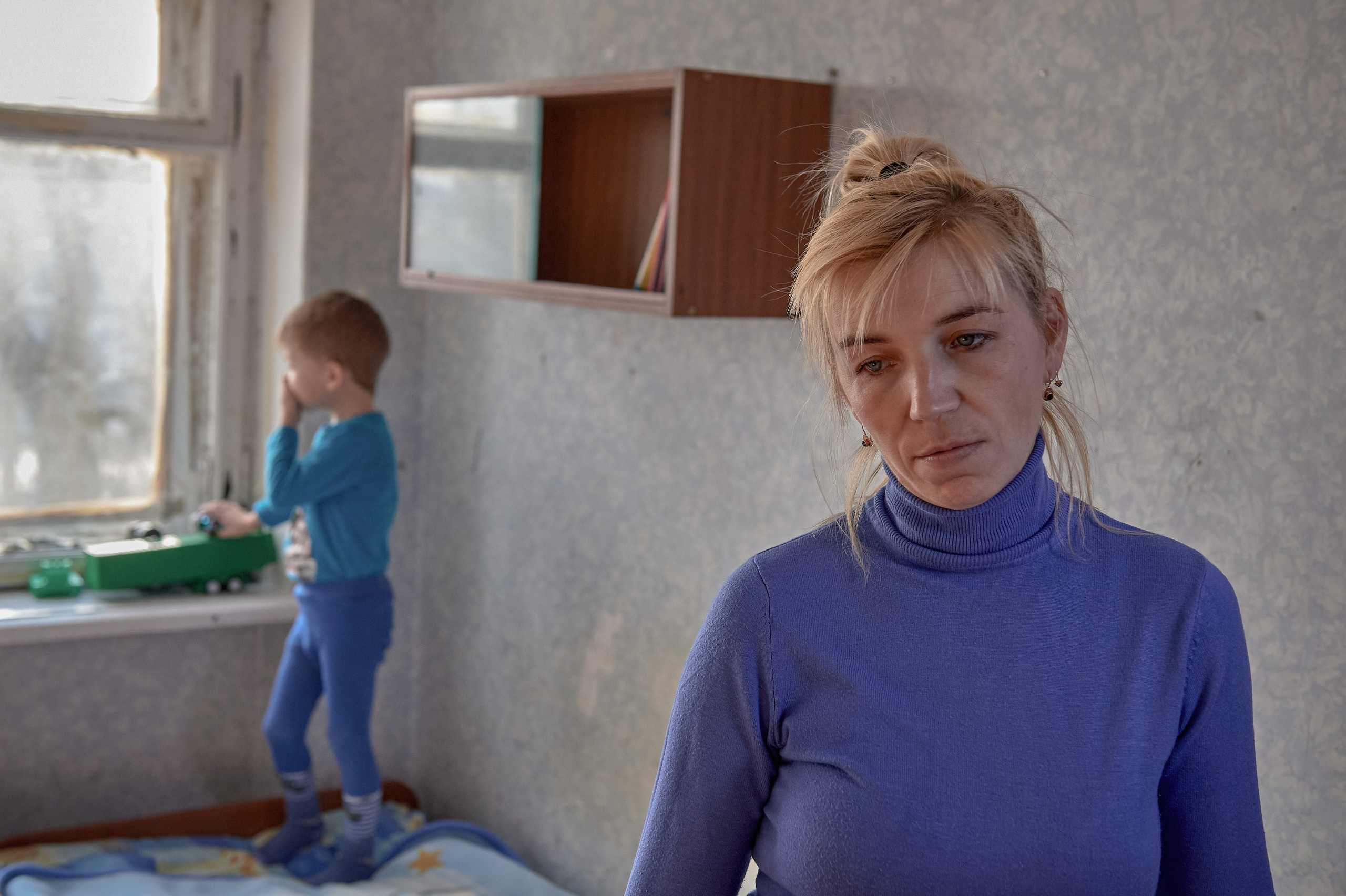 Svetlana and her 5-year-old son, evacuated from the village of Uspenka in the Luhansk region, are seen in a temporary refugee accommodation center located in a dormitory of DSTU in Shakhty, Rostov region. Svetlana lost her husband, who fought for the LNR. February 22, 2022.