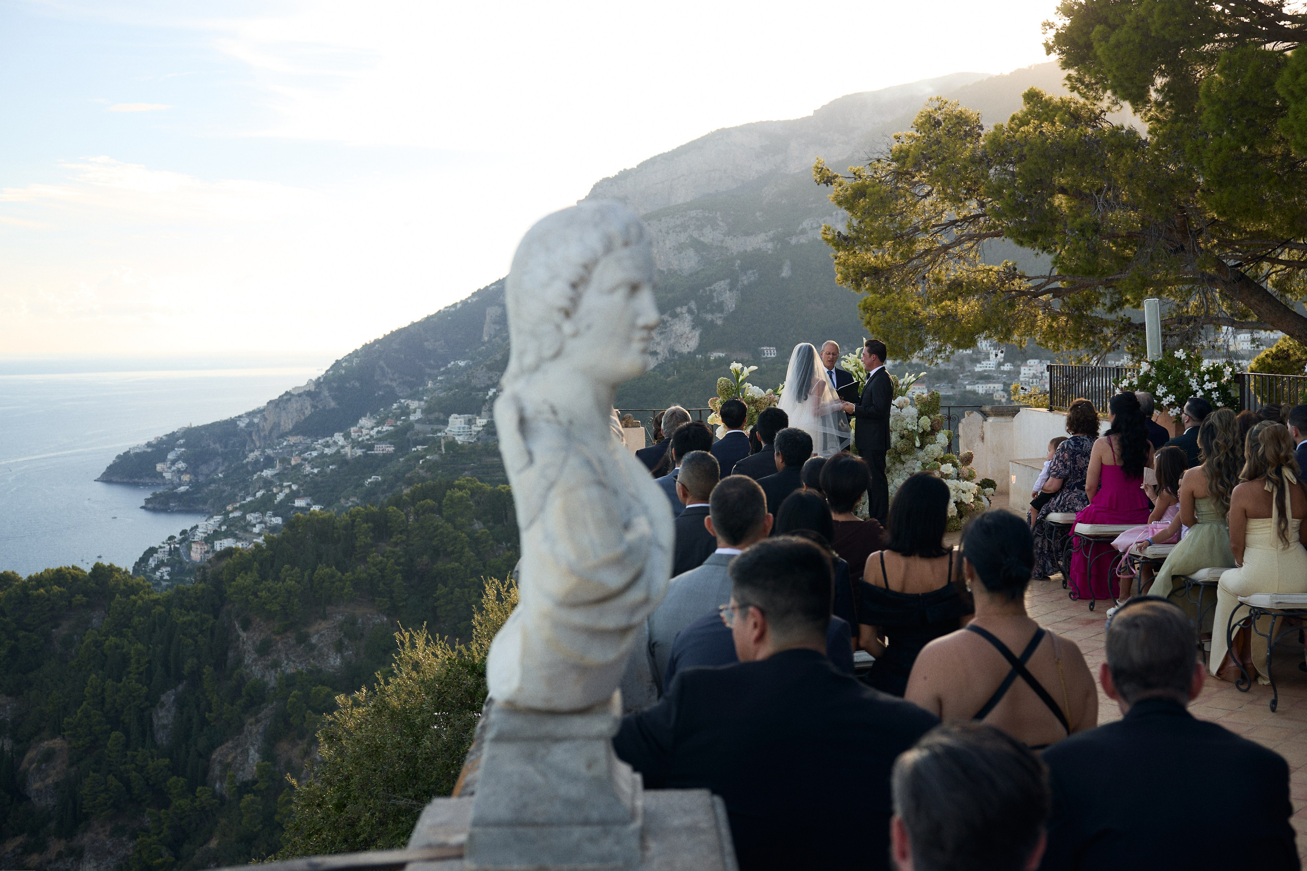 Guests watching the wedding ceremony above the Amalfi Coast