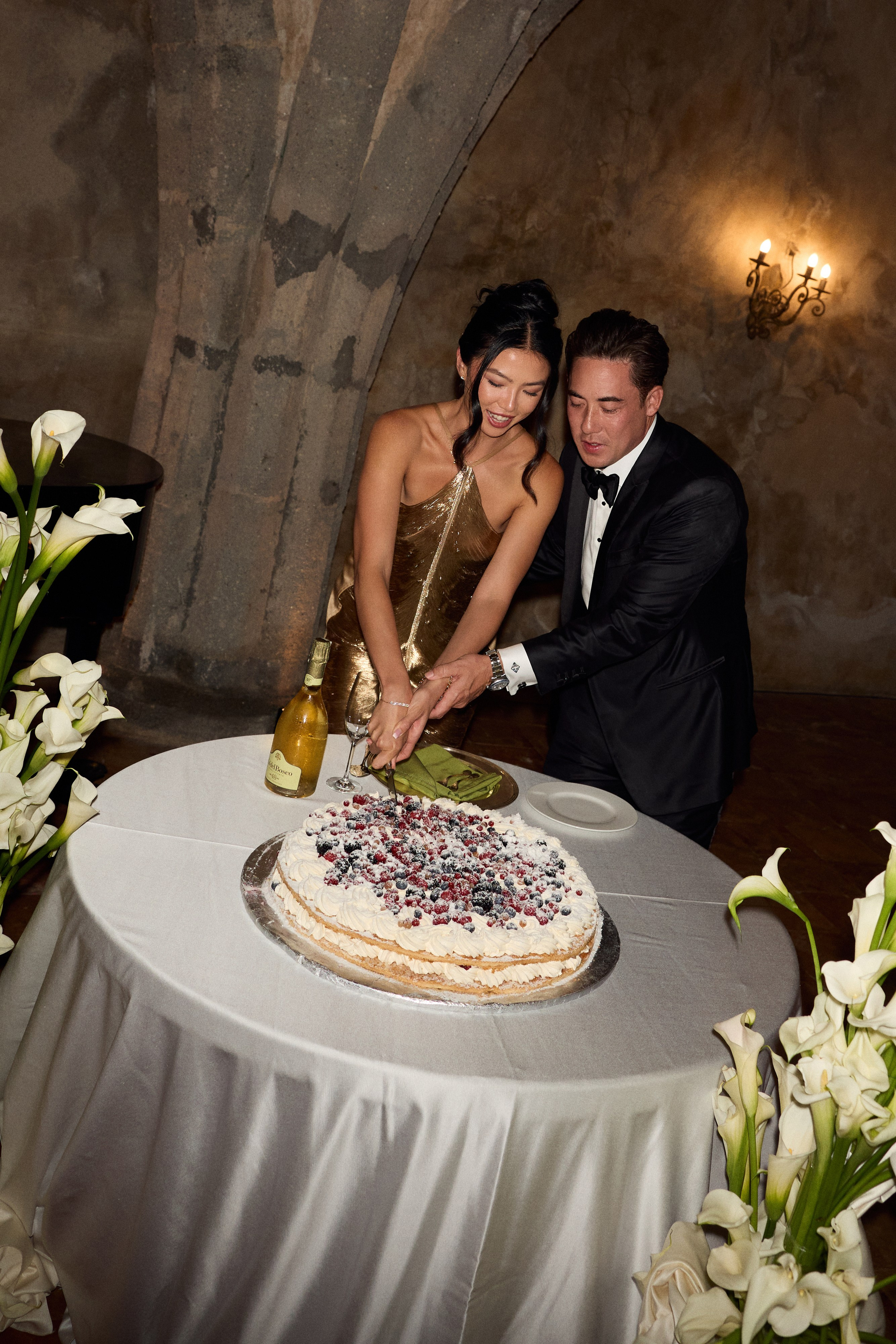 Bride and groom cutting their wedding cake