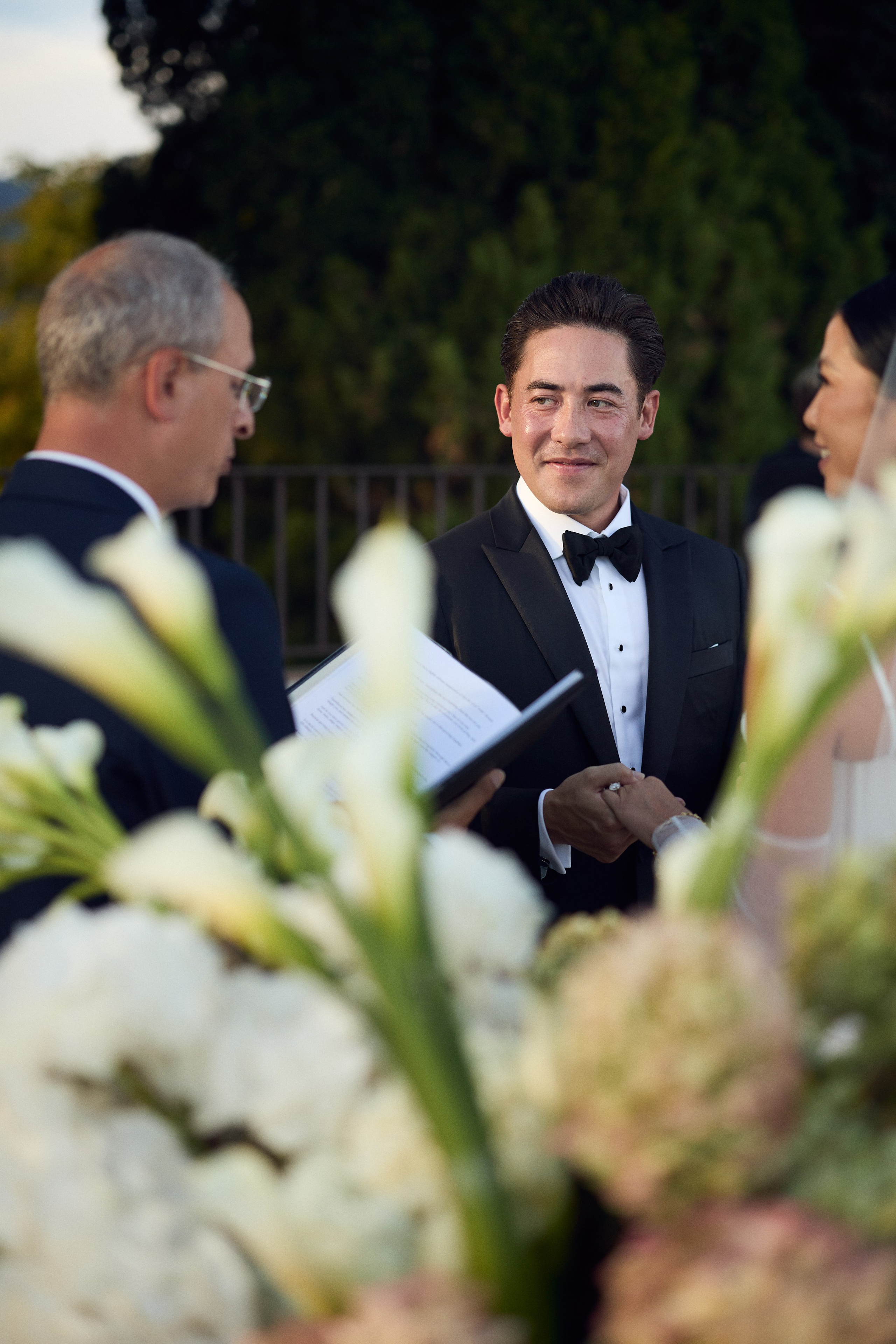 Groom smiling at the bride during the ceremony