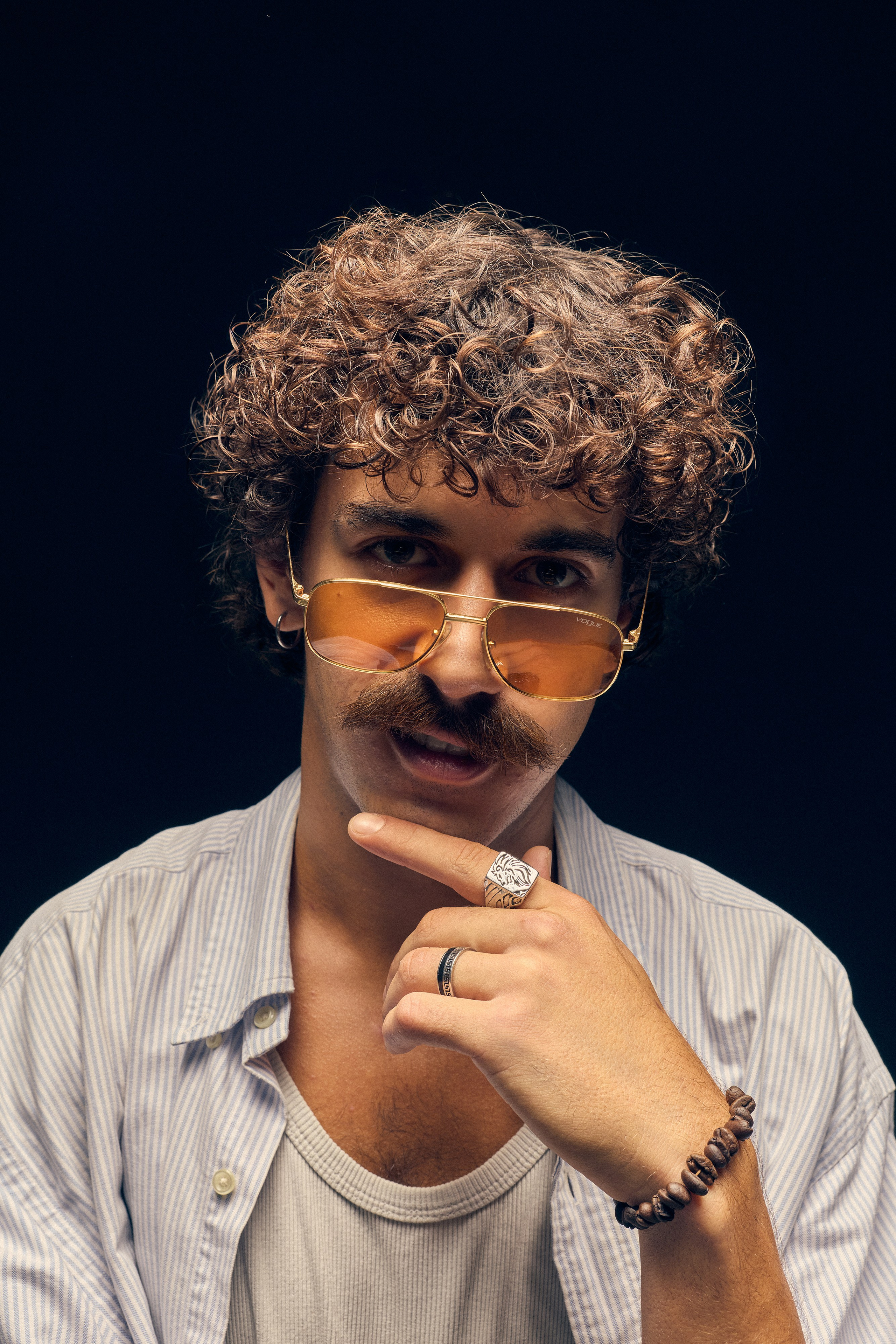 Alternative art portrait with flour and whiskey bottle on small table