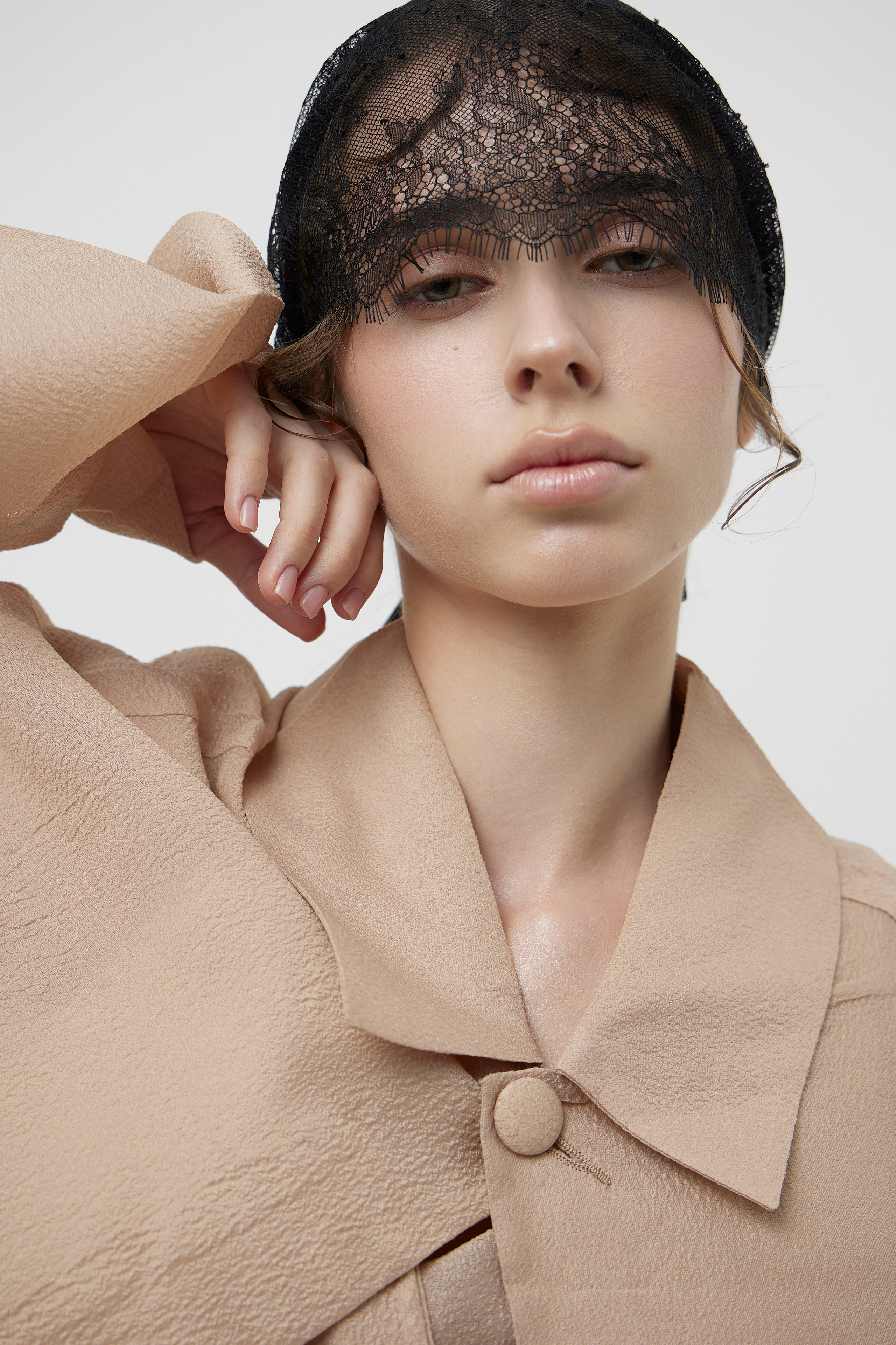 Minimalist fashion beauty portrait with designer garment photographed for contemporary fashion brand campaign in Sydney studio