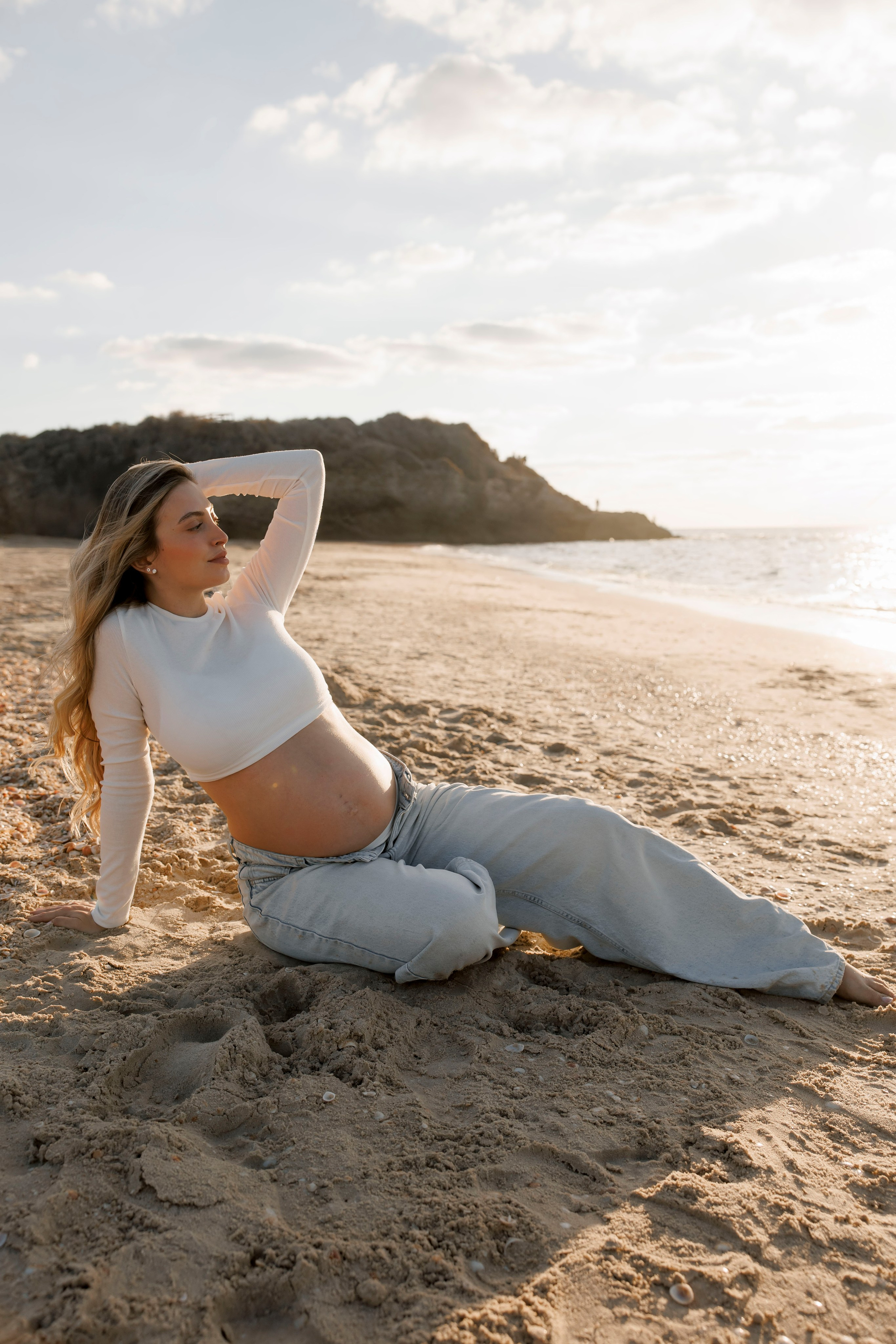Pregnancy photoshoot near the sea. Wedding and family photographer