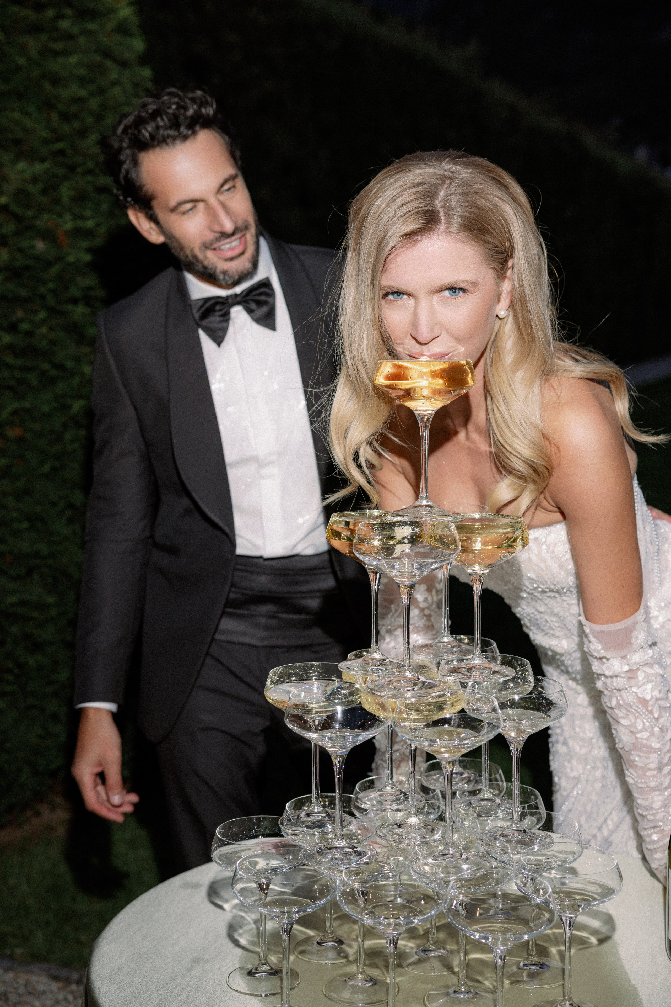 Champagne tower celebration at a luxury wedding reception