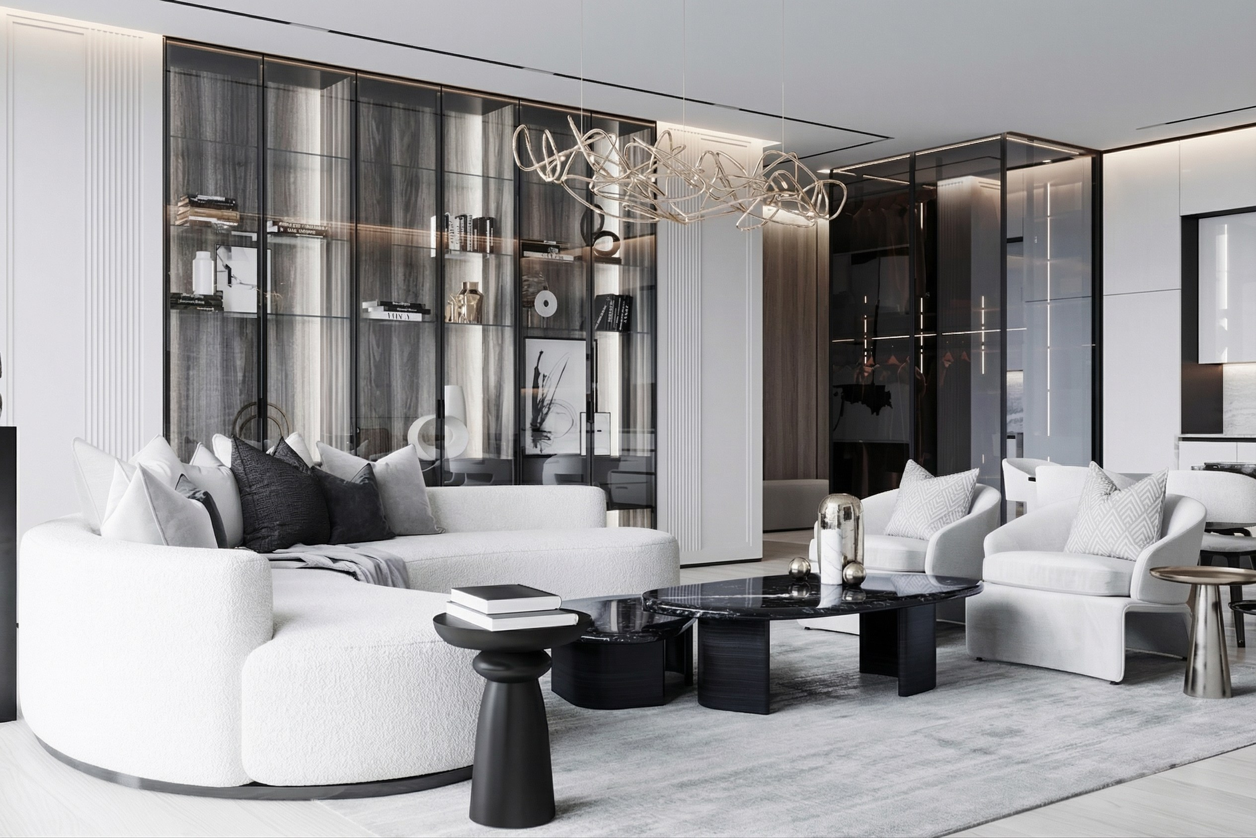 Современная гостиная в эстетике quiet luxury по проекту Валерии Котович: радиусный диван, журнальные столики из антрацитового камня и масштабная система хранения с подсветкой в квартире 113 м².