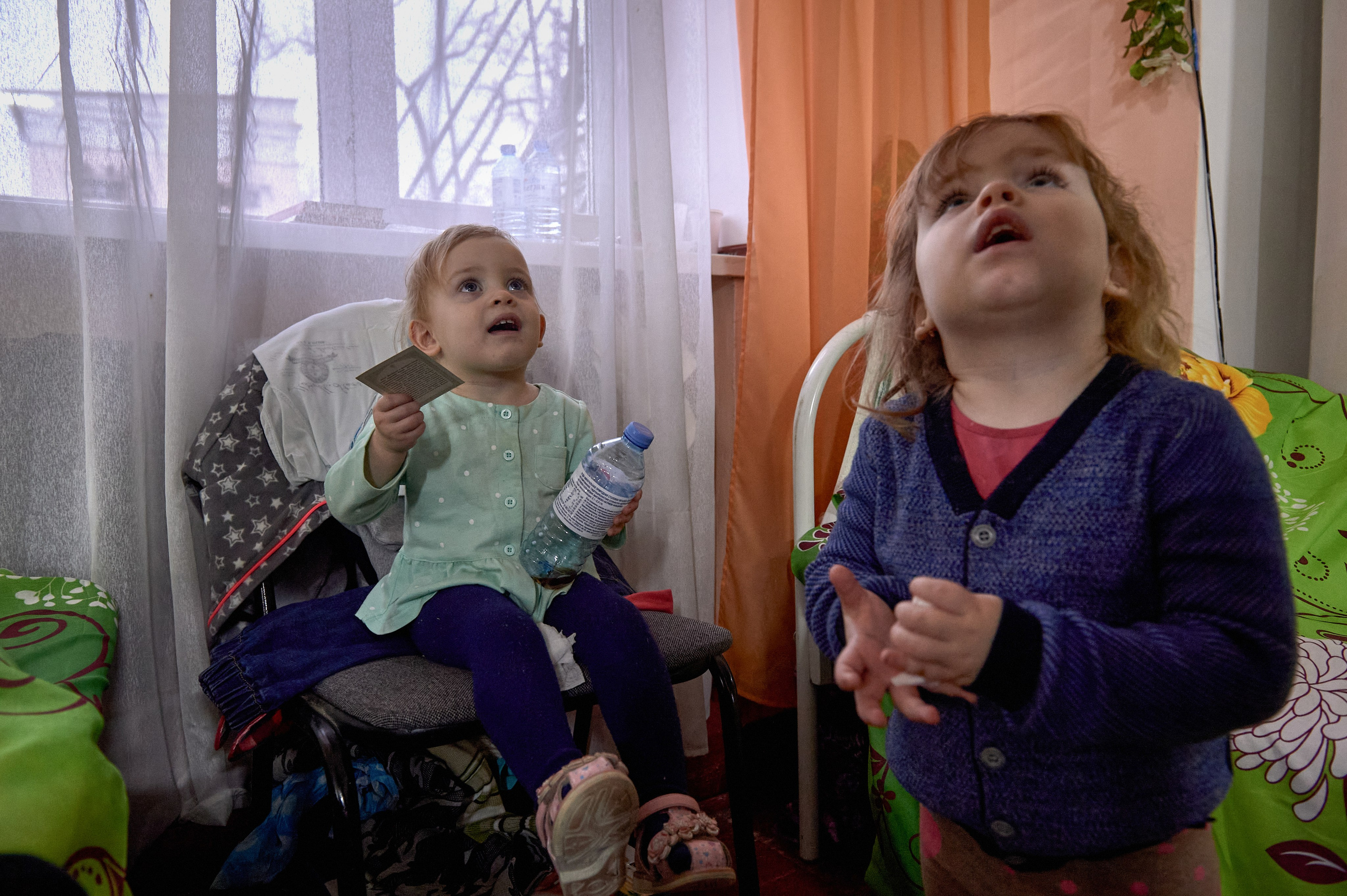 Children evacuated with their mother, Oksana, from Rodakovo village in the Luhansk region, whose father was mobilized, in a temporary refugee accommodation center set up in the cultural center of Krasnogornyatsky, Rostov region, February 26, 2022.