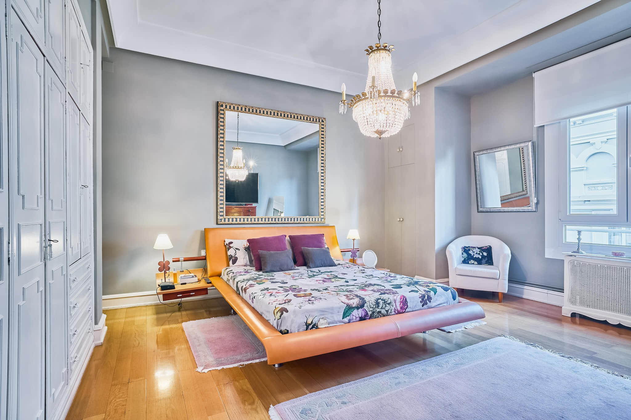 Spacious bedroom with large bed and panoramic windows in Valencia