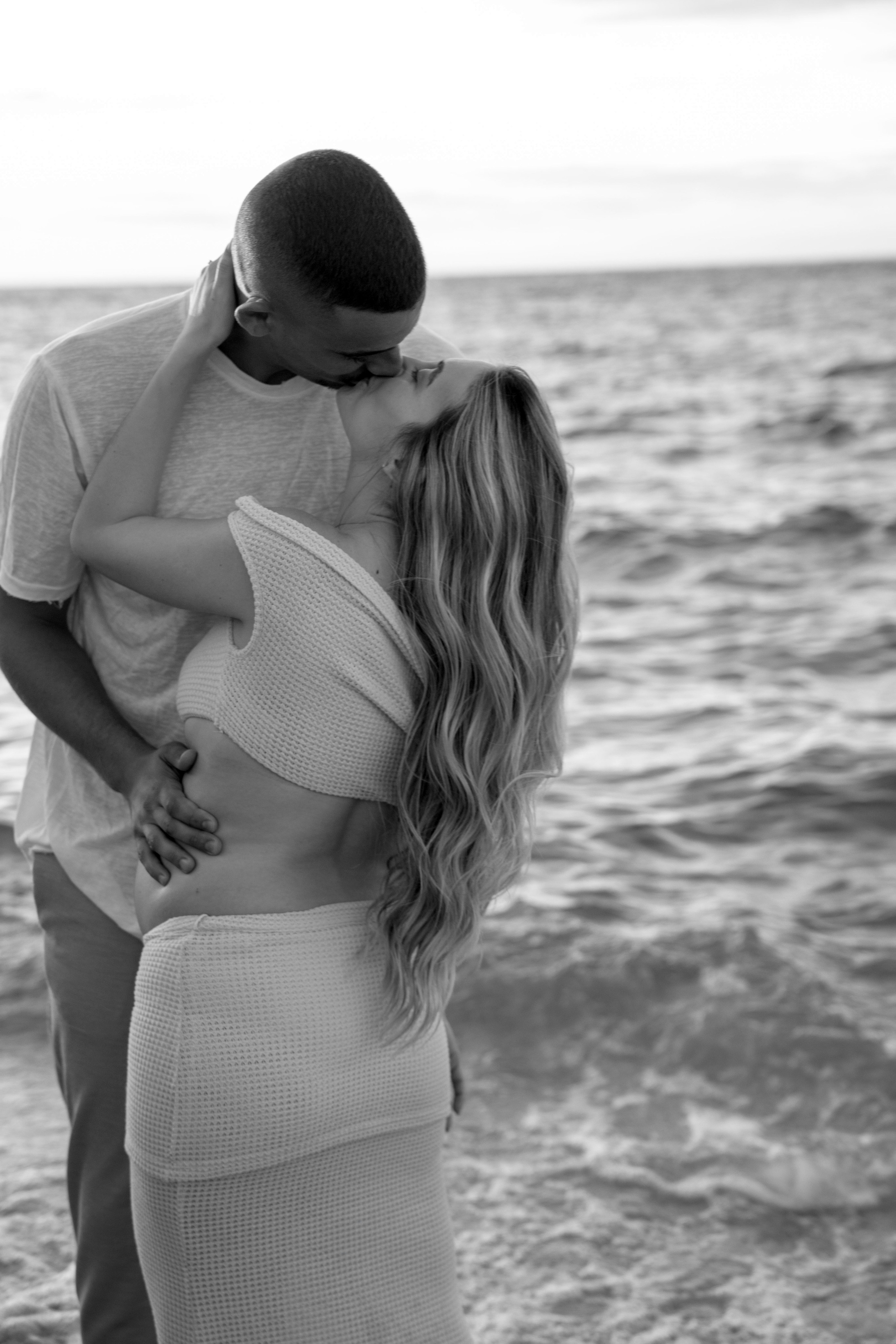Pregnancy photoshoot near the sea. Wedding and family photographer