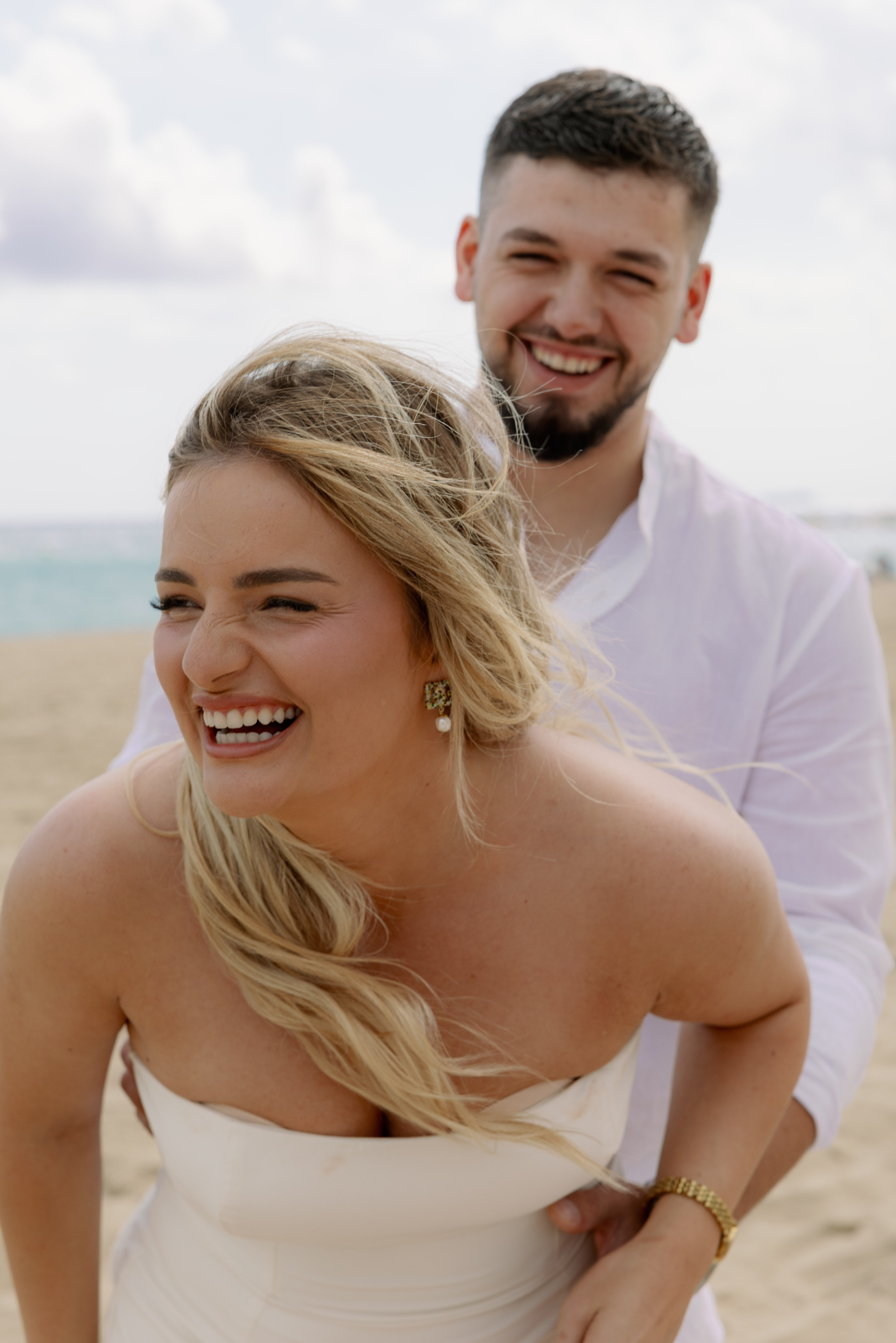 Couple hugging after engagement on a rooftop terrace