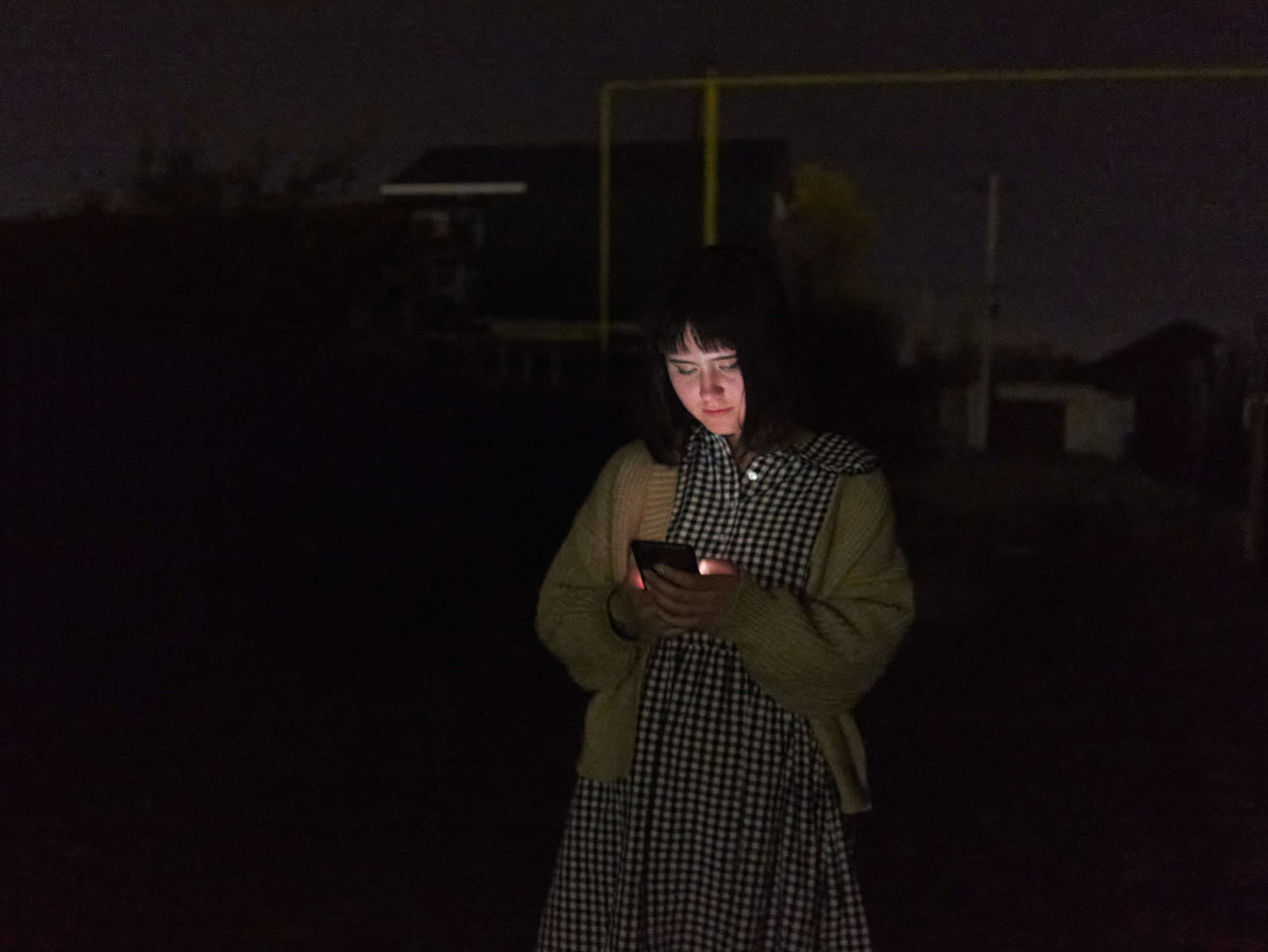 A girl in one of the Astrakhan outskirts. The private sector is like in a village here, the streets are almost not illuminated at night, and the roads are in very poor condition – in spring and autumn, some taxi drivers may refuse to go to the point because of dirt and potholes
