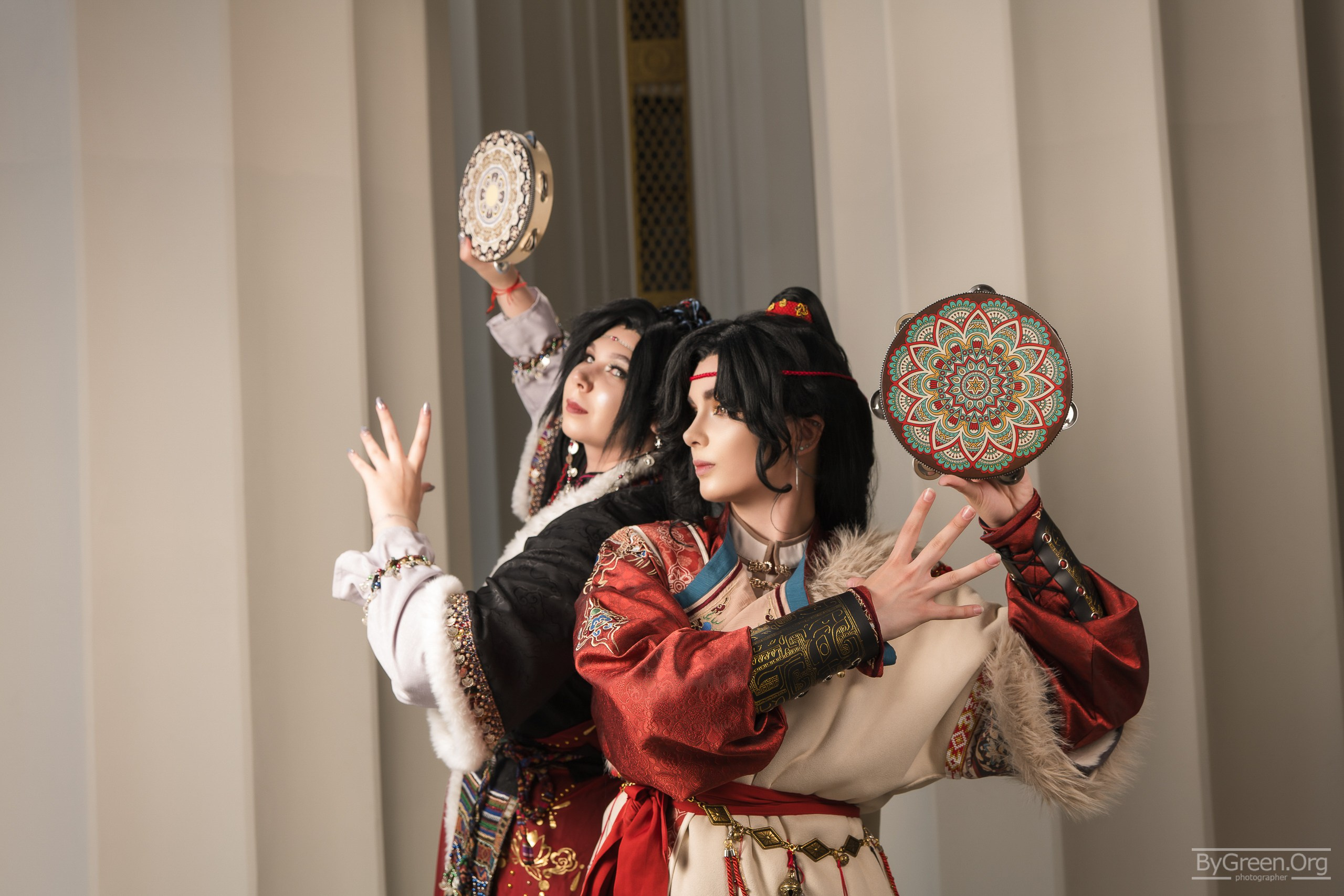 Cosplay at VK Fest 2026 — duo with tambourines by the columns, Moscow