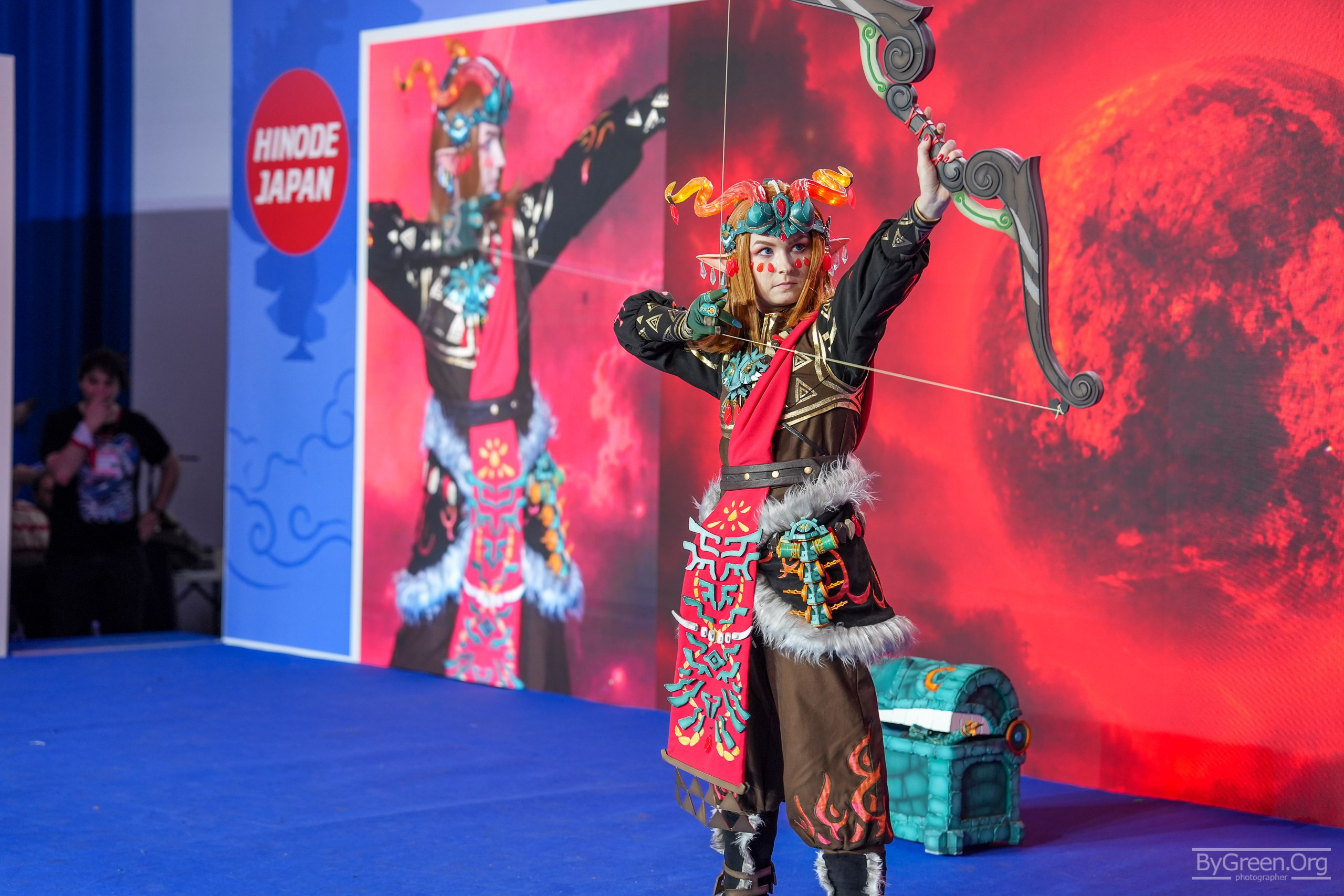 Cosplay of Link from The Legend of Zelda — red mask, bow and chest, Hinode 2026, Moscow