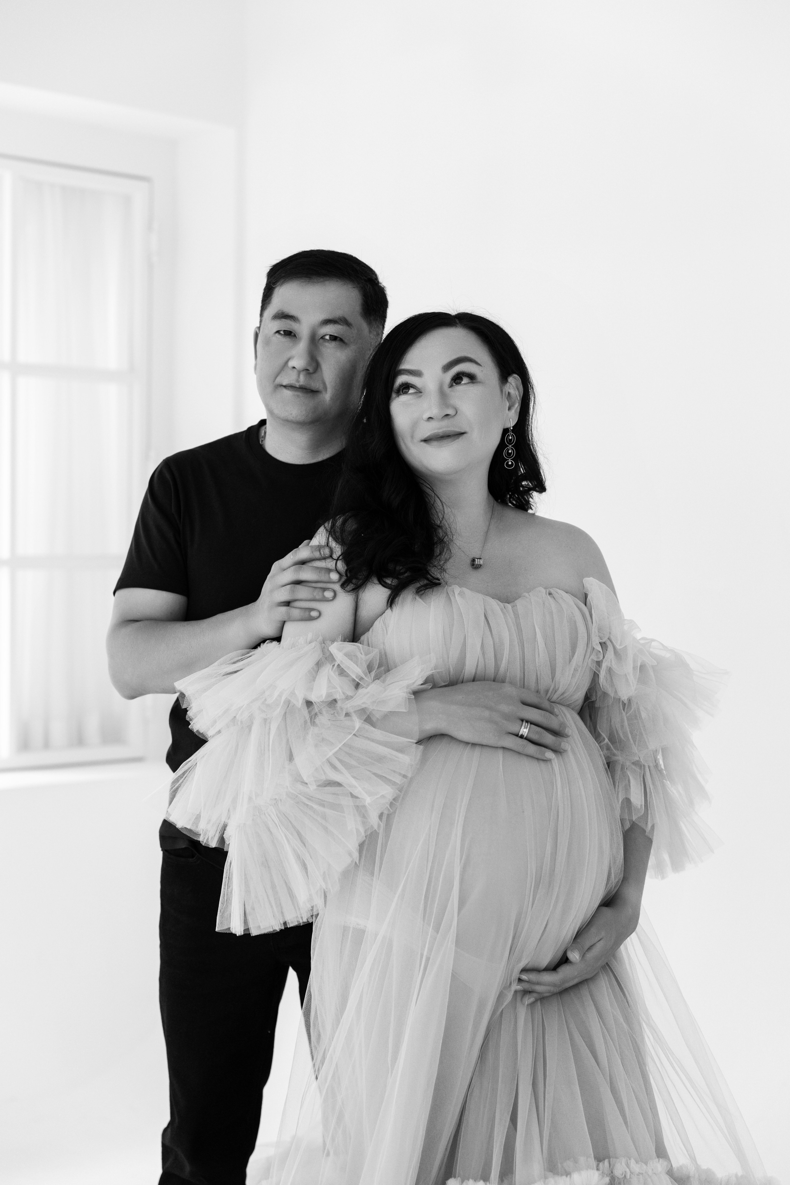 Pregnancy photo session with husband in studio