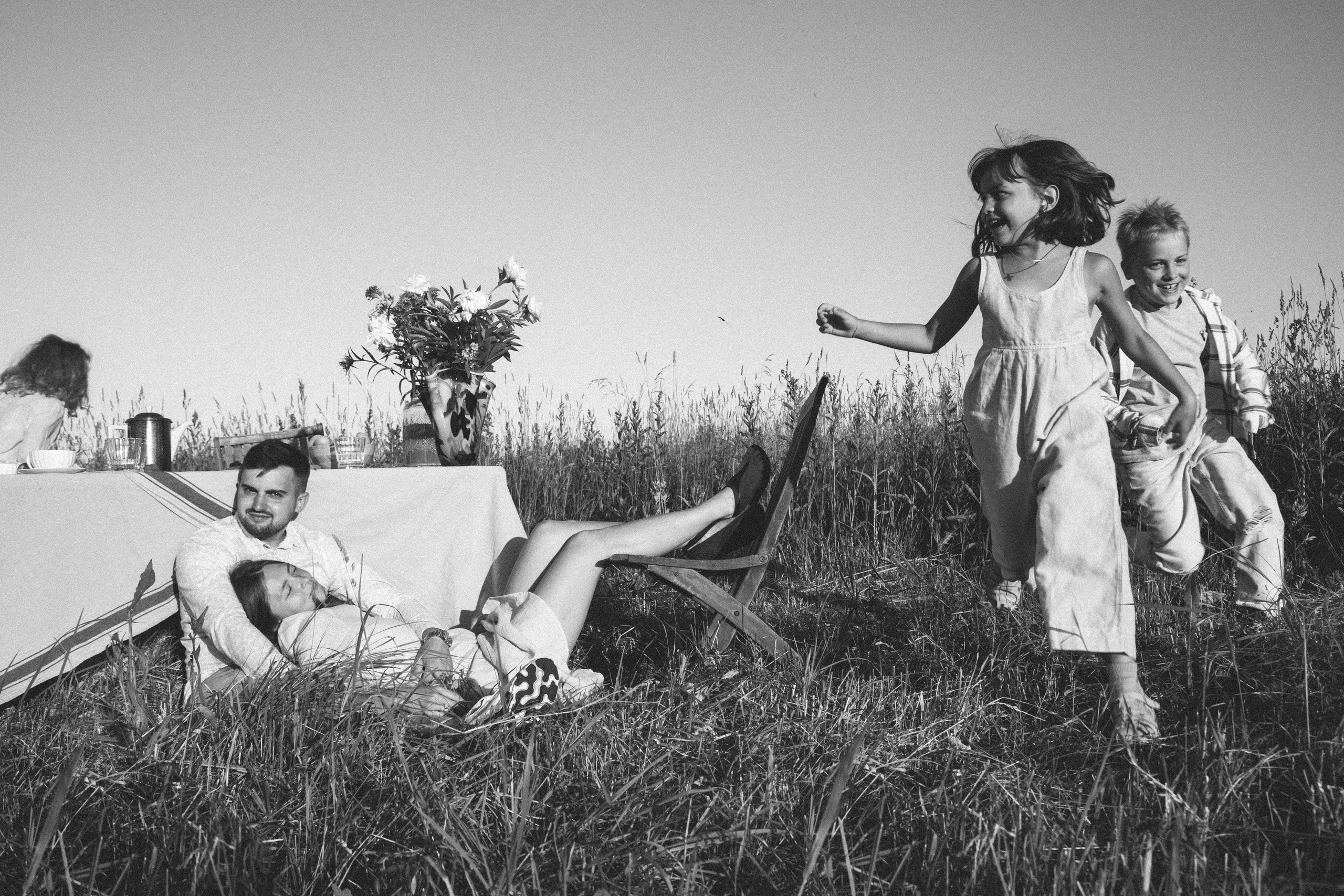 Family dining in the field. Home