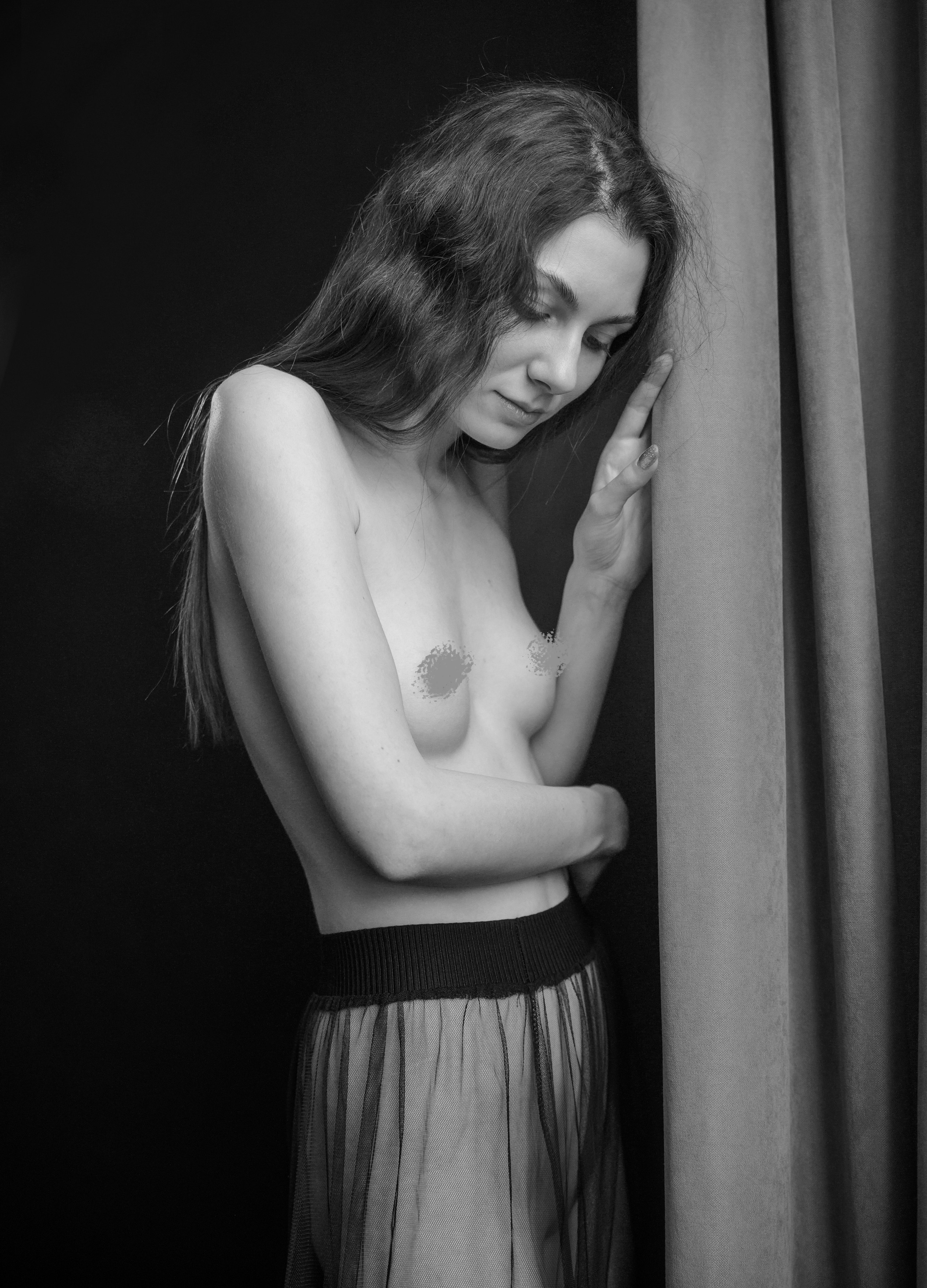 A series of creative photos taken in the studio. The photos are made in the nude genre. Black and white photo