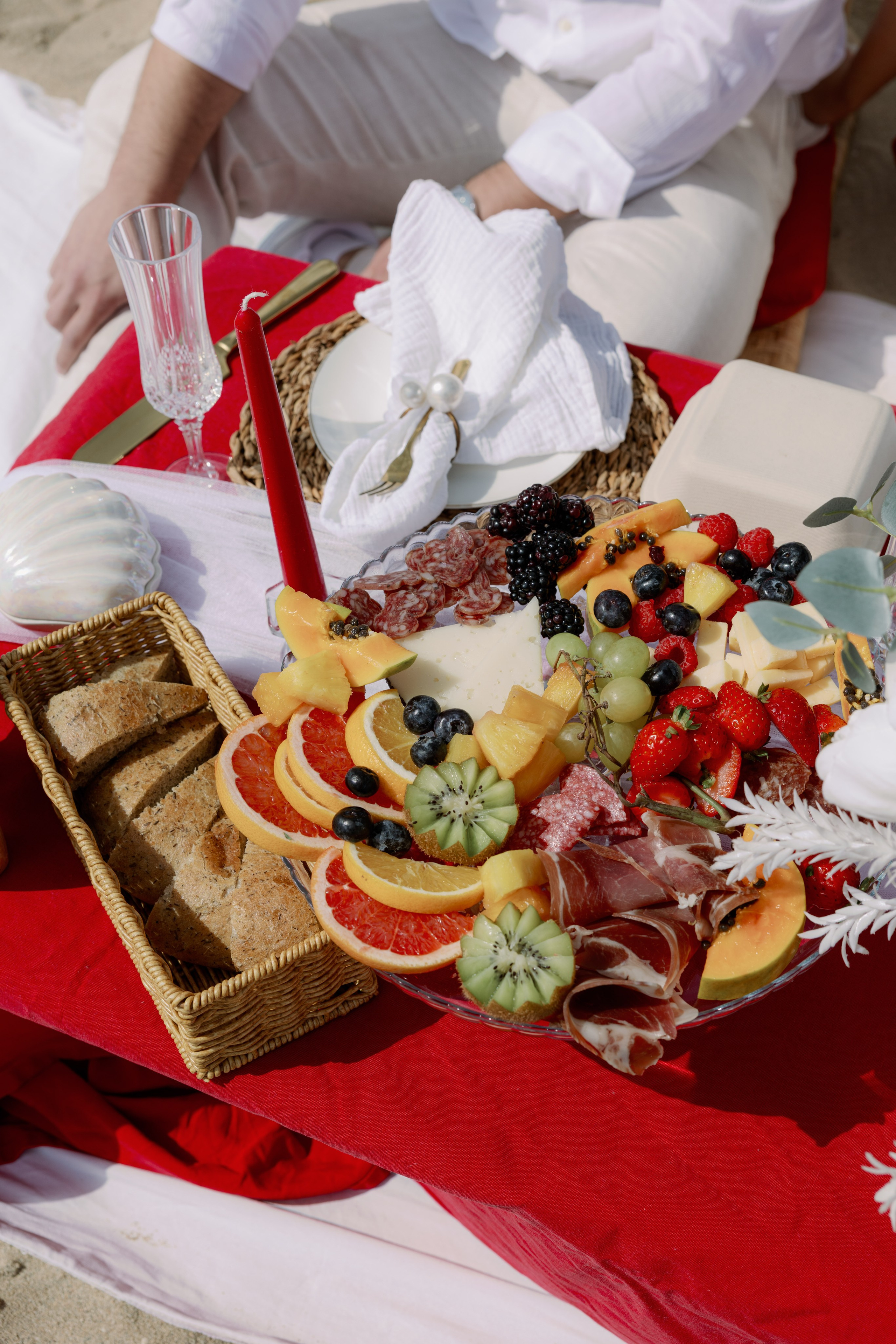 Couple celebrating engagement by the Barcelona coastline