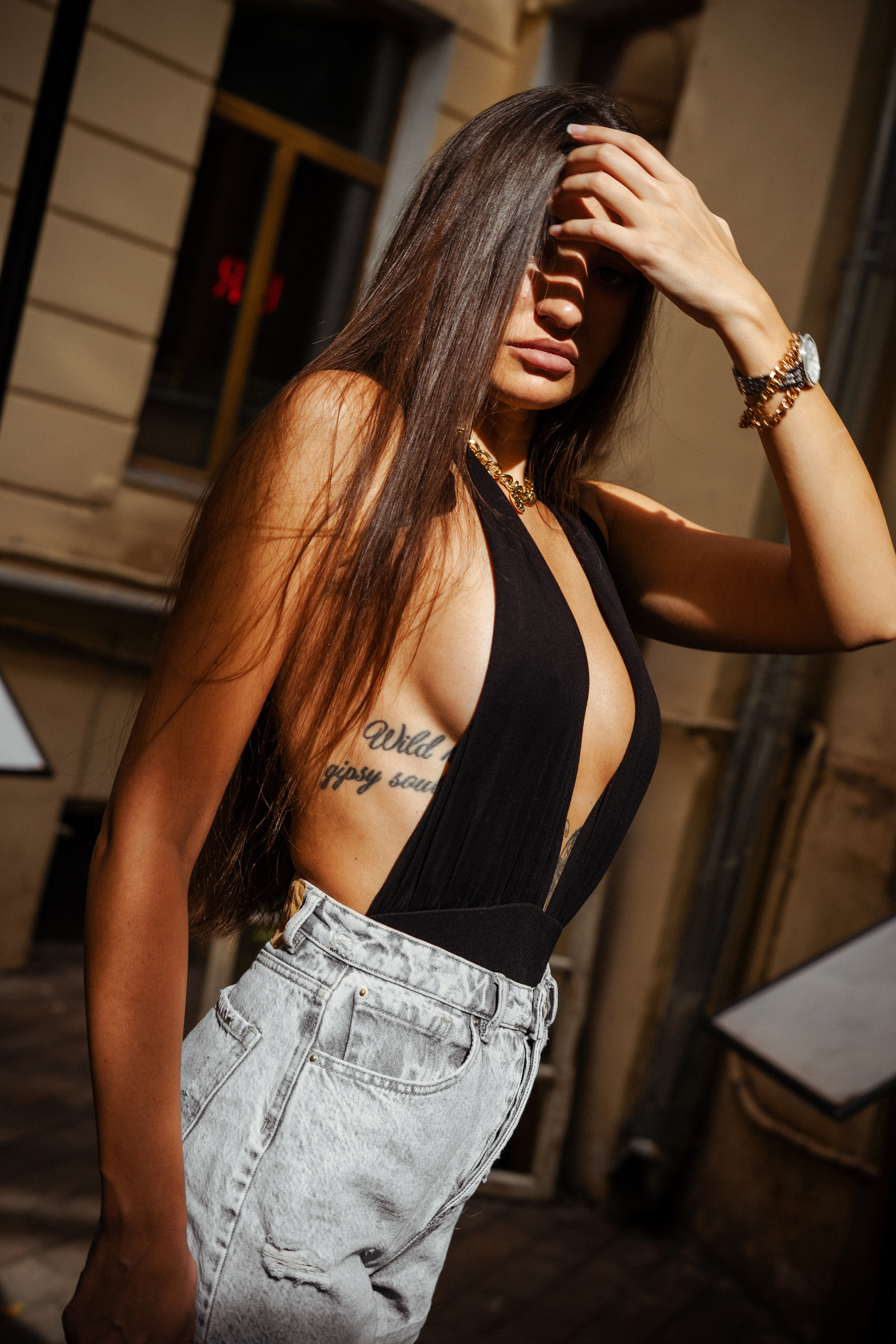 photoshoot of a beautiful dark-haired girl on the streets of Moscow